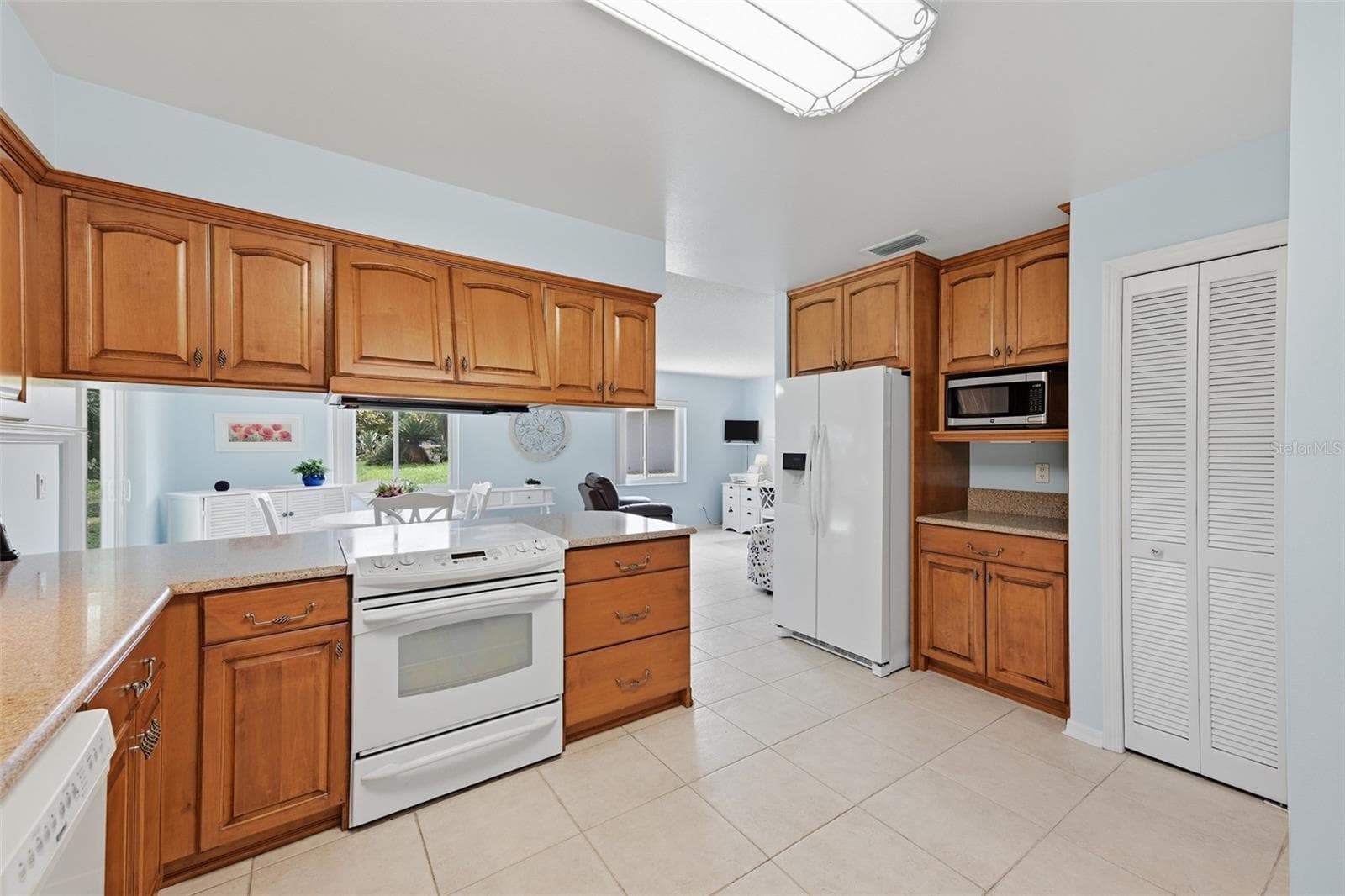 KITCHEN FRIDGE AND PANTRY - 1803 NEW BEDFORD DR, SUN CITY CENTER