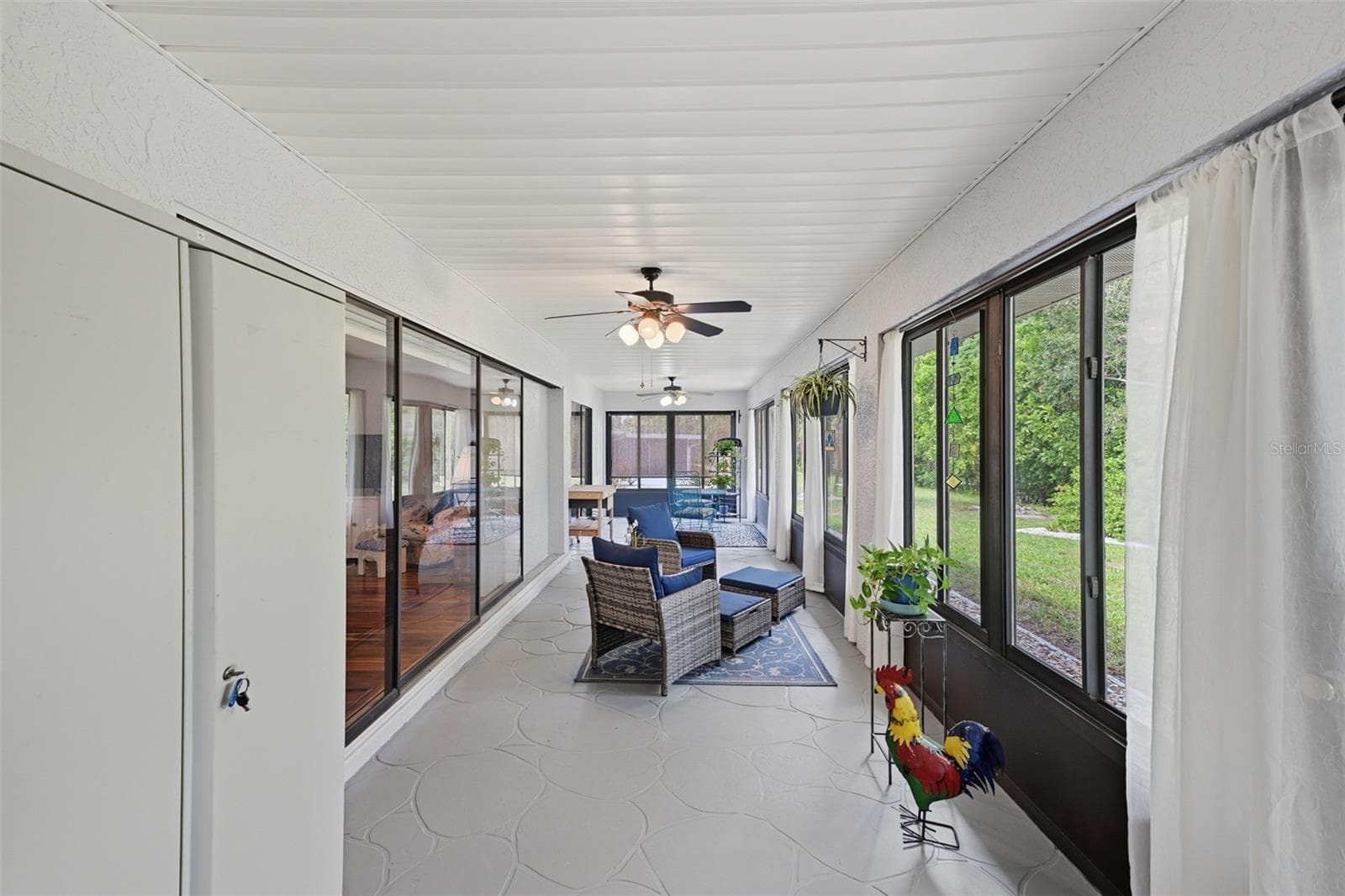 GLASS ENCLOSED LANAI IS PERFECT FOR MORNING COFFEE OR AFTERNOON RELAXATION. PLENTY OF ROOM FOR HOBBIES OR GUESTS. - 1803 NEW BEDFORD DR, SUN CITY CENTER