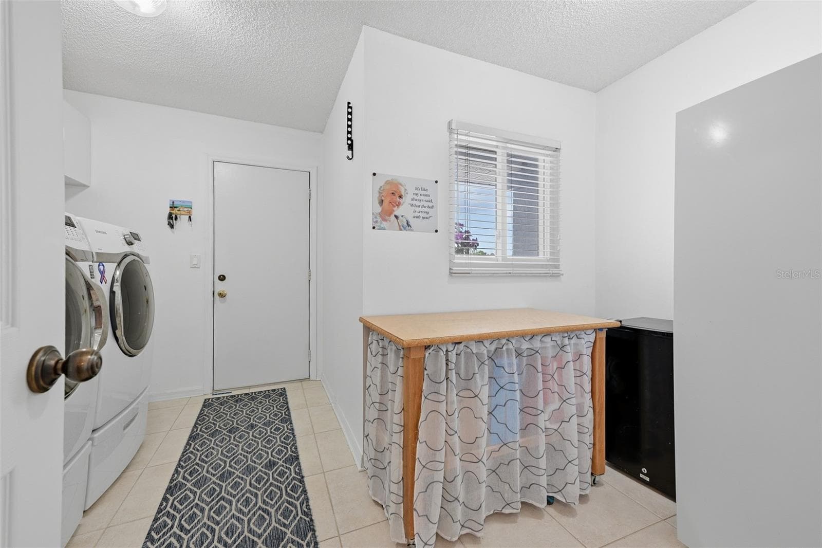 LAUNDRY ROOM HAS ROOF FOR EXTRA STORAGE OR REFRIGERATOR OR FREEZER. - 1803 NEW BEDFORD DR, SUN CITY CENTER