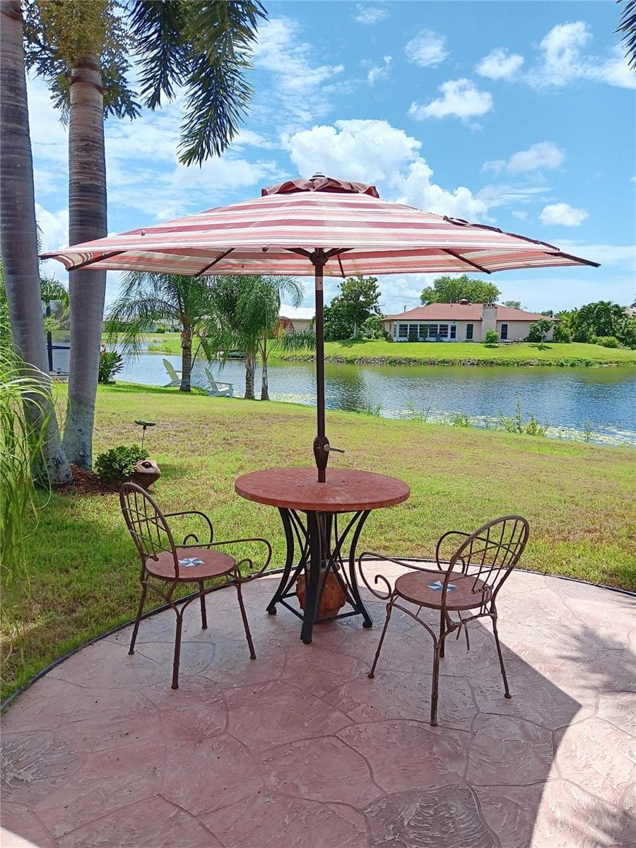Concrete Patio out back Overlooking Claw Lake - 980 N GONDOLA DR, VENICE