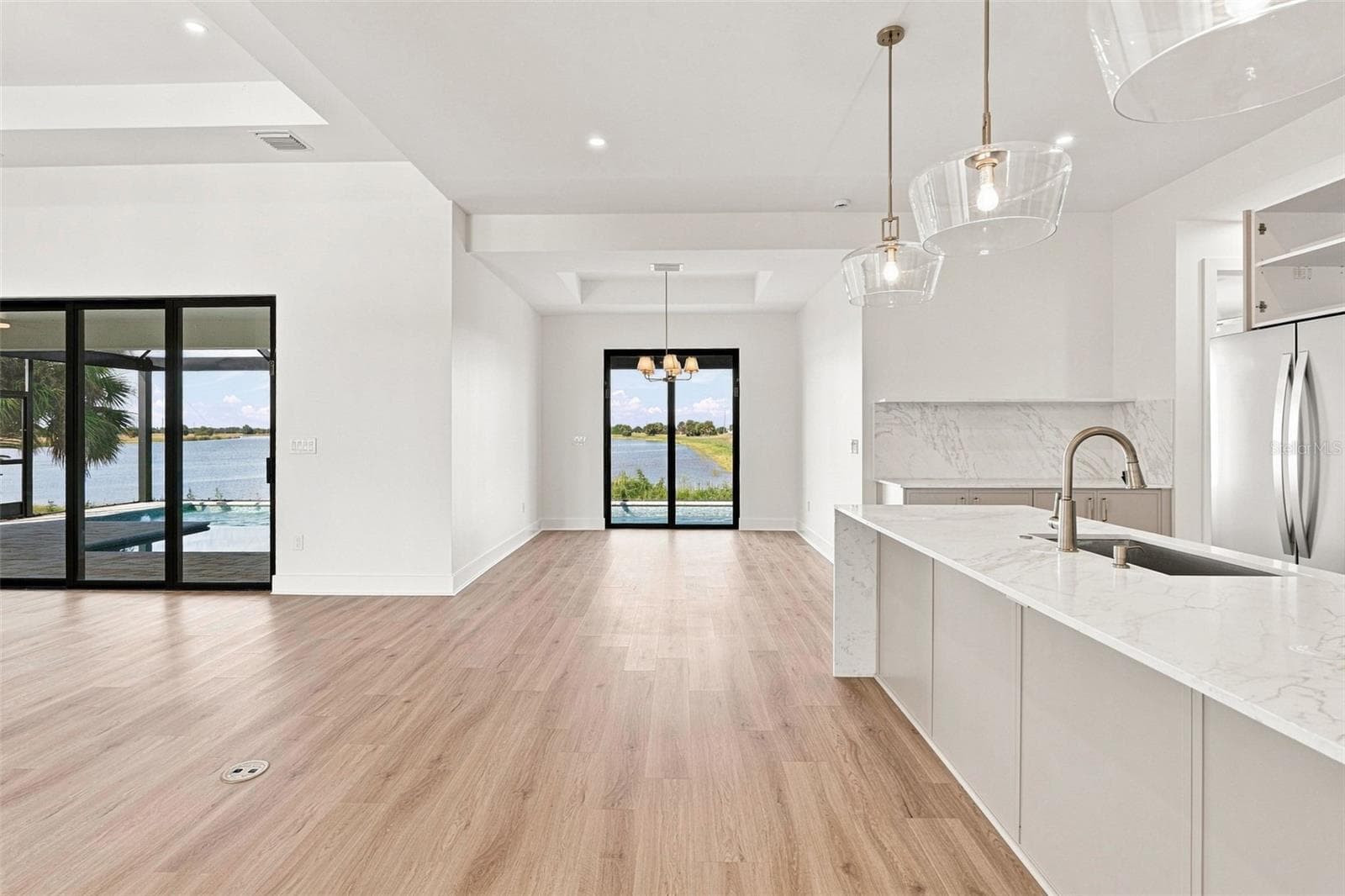 Bright Open Concept Living Room into Dining Area - 44 SUNFLOWER DR, PLACIDA