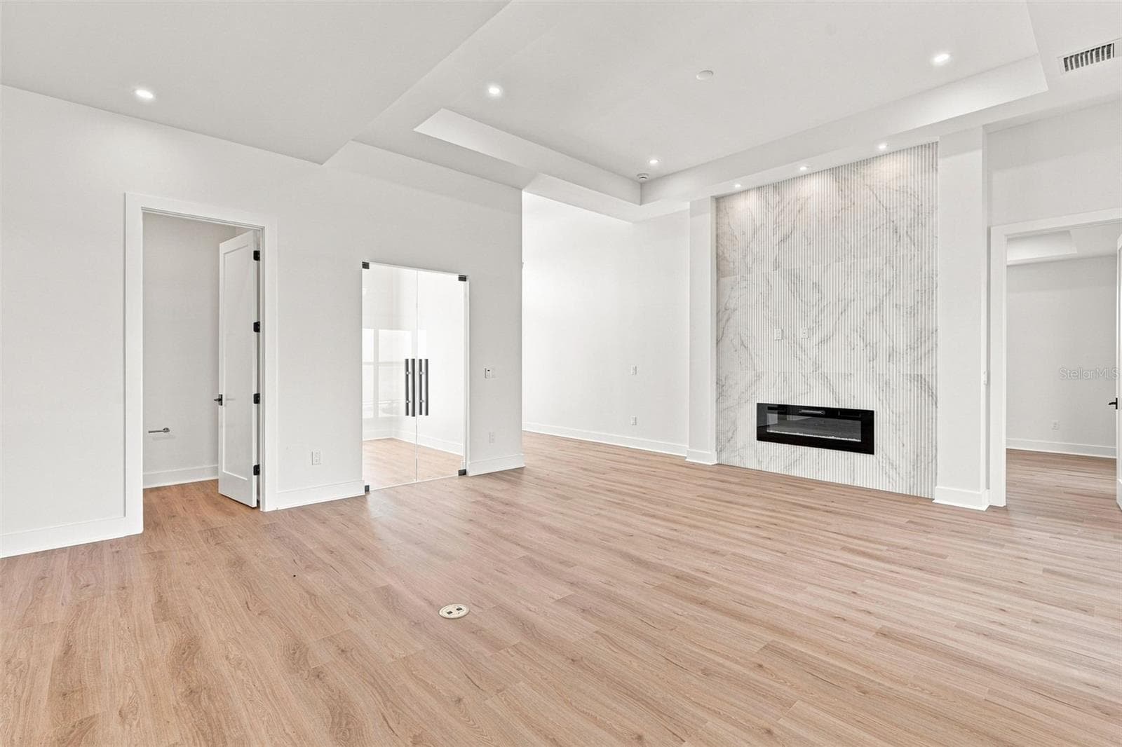 Modern Living Room with Sleek Fireplace Wall - 44 SUNFLOWER DR, PLACIDA