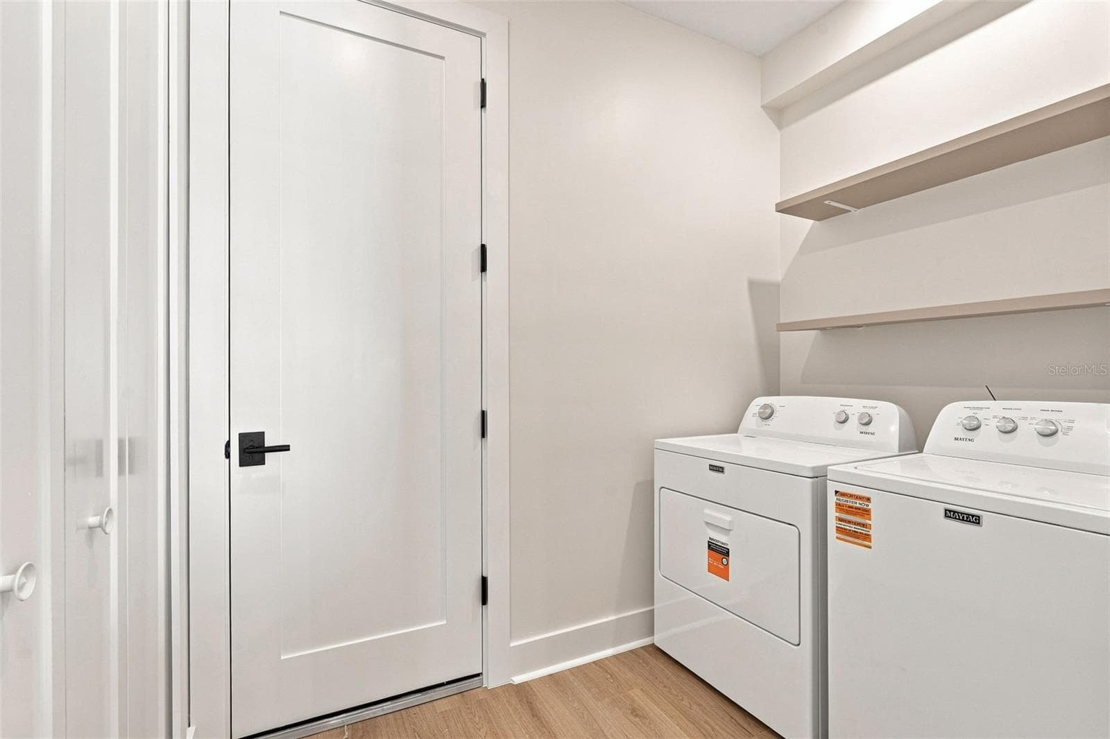 Laundry Room with Washer, Dryer & Built in Shelving - 44 SUNFLOWER DR, PLACIDA