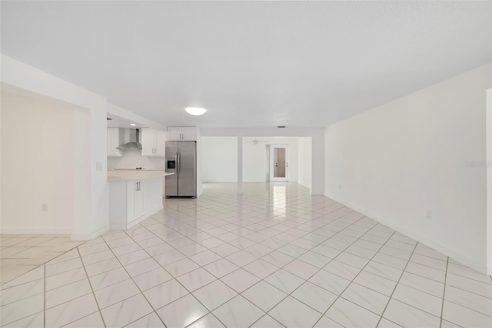 Living Room with a glimpse of the remodeled Kitchen and the Dining Room - 708 GARFIELD DR, SARASOTA
