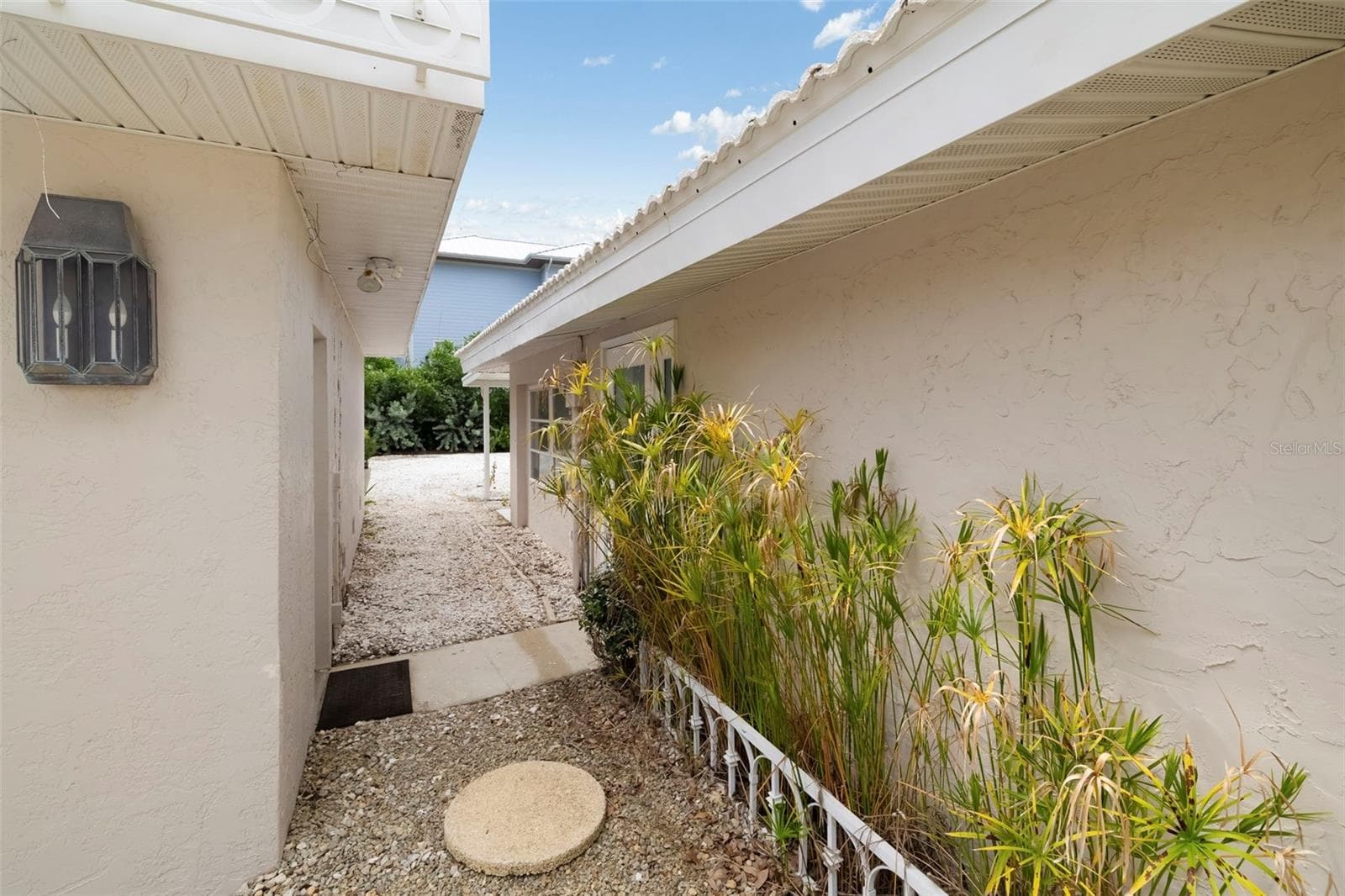 Walk through between the house and the oversized detached 2-car garage - 708 GARFIELD DR, SARASOTA