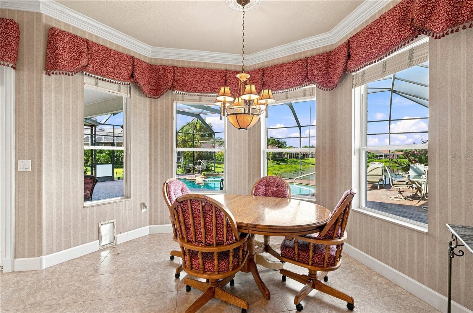 Breakfast nook with lake view - 9271 WESTSHORE DR, WEEKI WACHEE