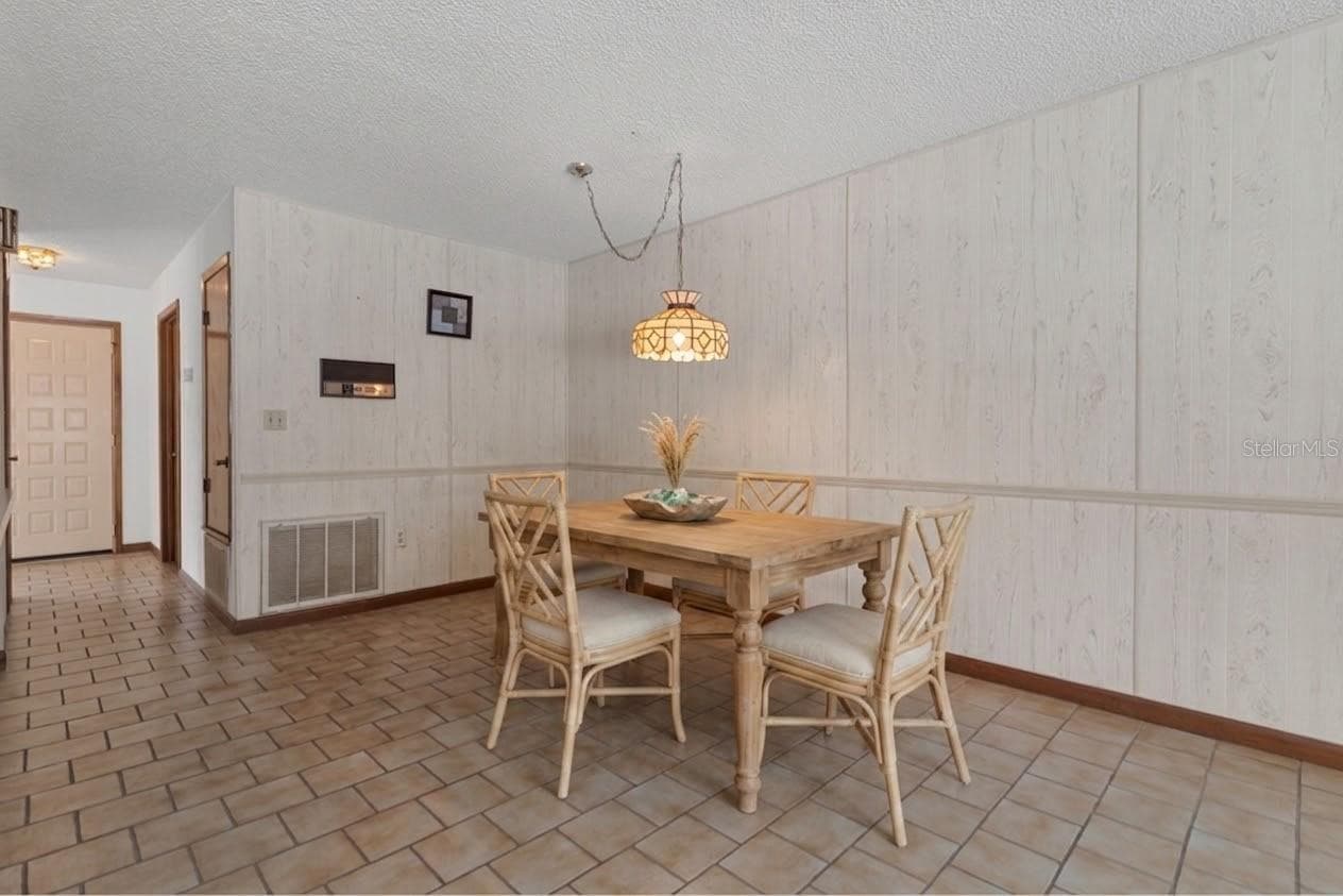 Staged photo of the breakfast nook - 9009 HEATHER BLVD, WEEKI WACHEE