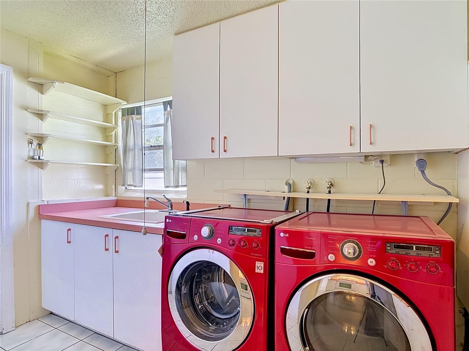 indoor laundry room with mop sink and pantry - 1237 JEFFERY DR, PORT ORANGE