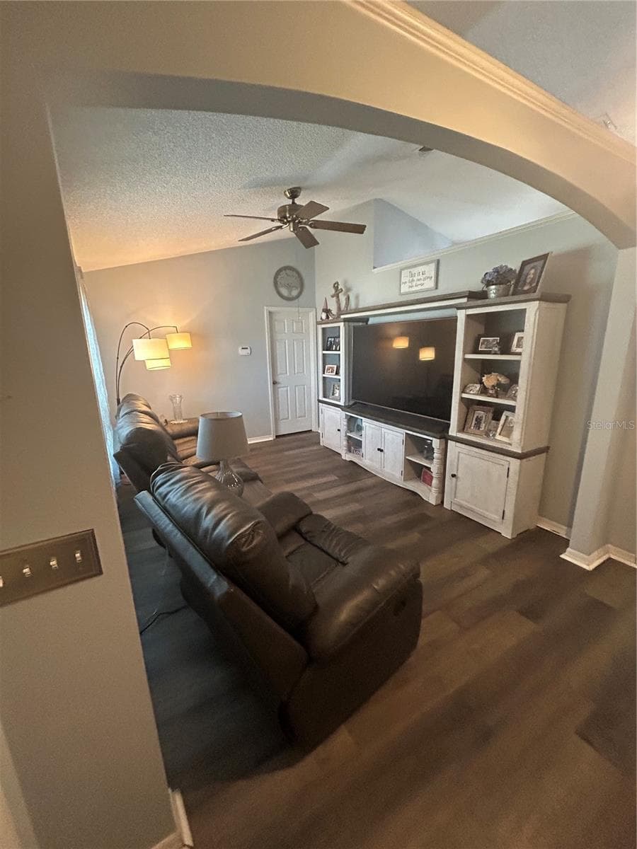 Split floorplan provides two living rooms. Living room #1 by the master bedroom. - 3243 BRETTON WOODS TER, DELTONA