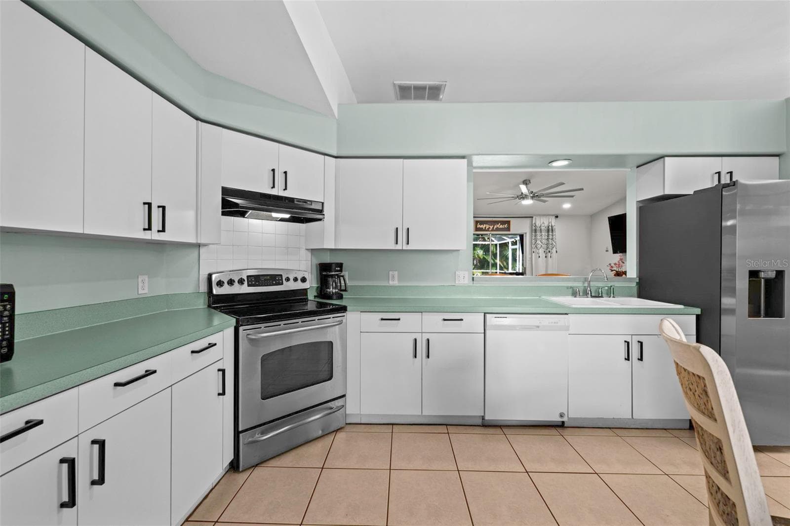 Kitchen with pass-through window - 3112 SW 16TH PL, CAPE CORAL