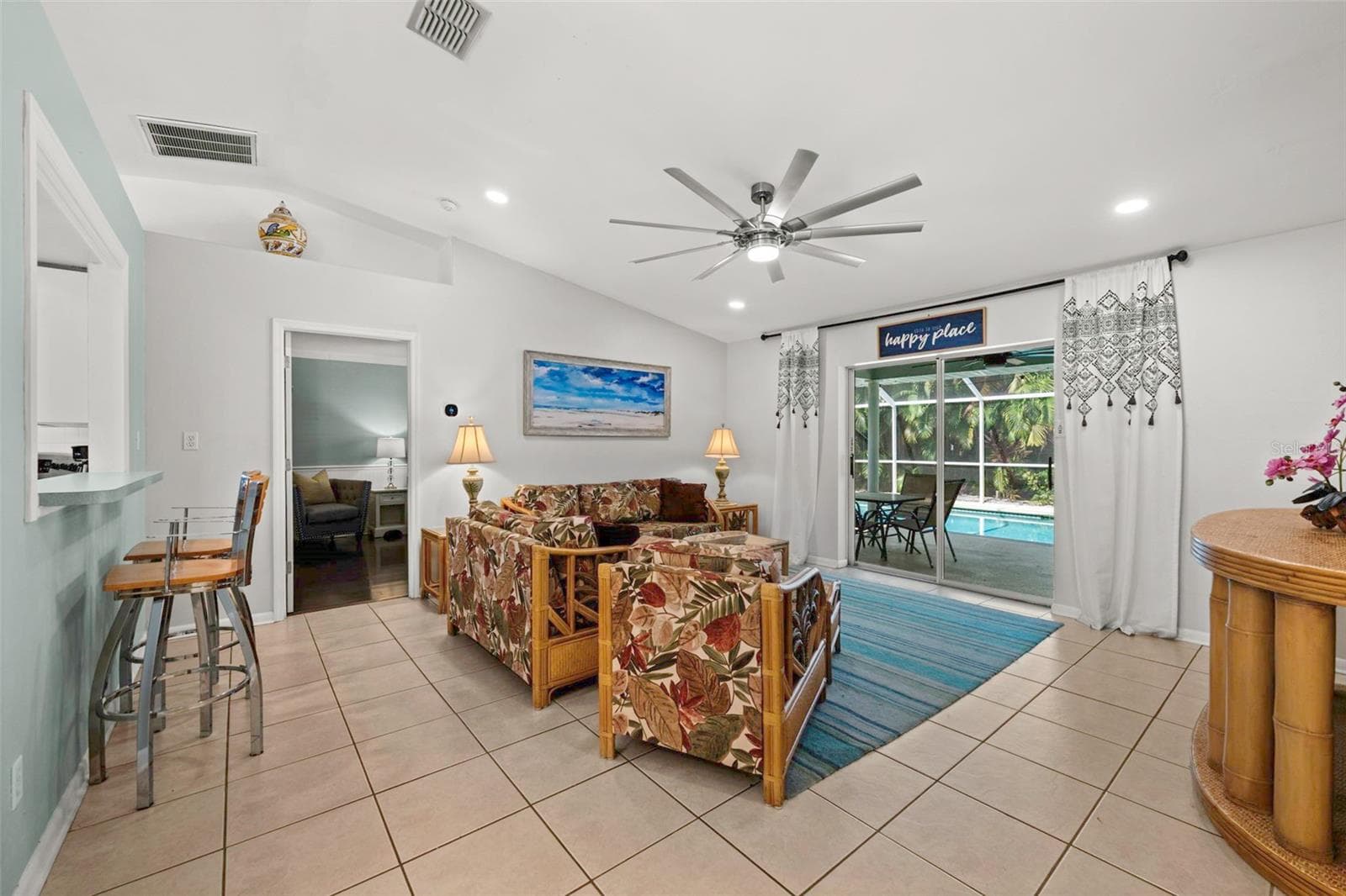 Living room as you enter, looking straight through to the pool - 3112 SW 16TH PL, CAPE CORAL
