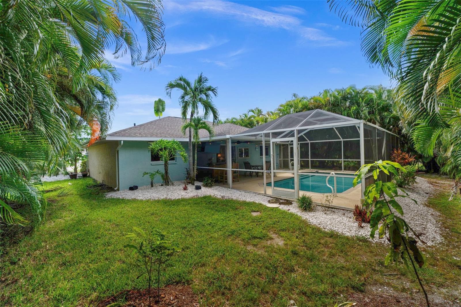 Yard is surrounded by tropical landscaping - 3112 SW 16TH PL, CAPE CORAL