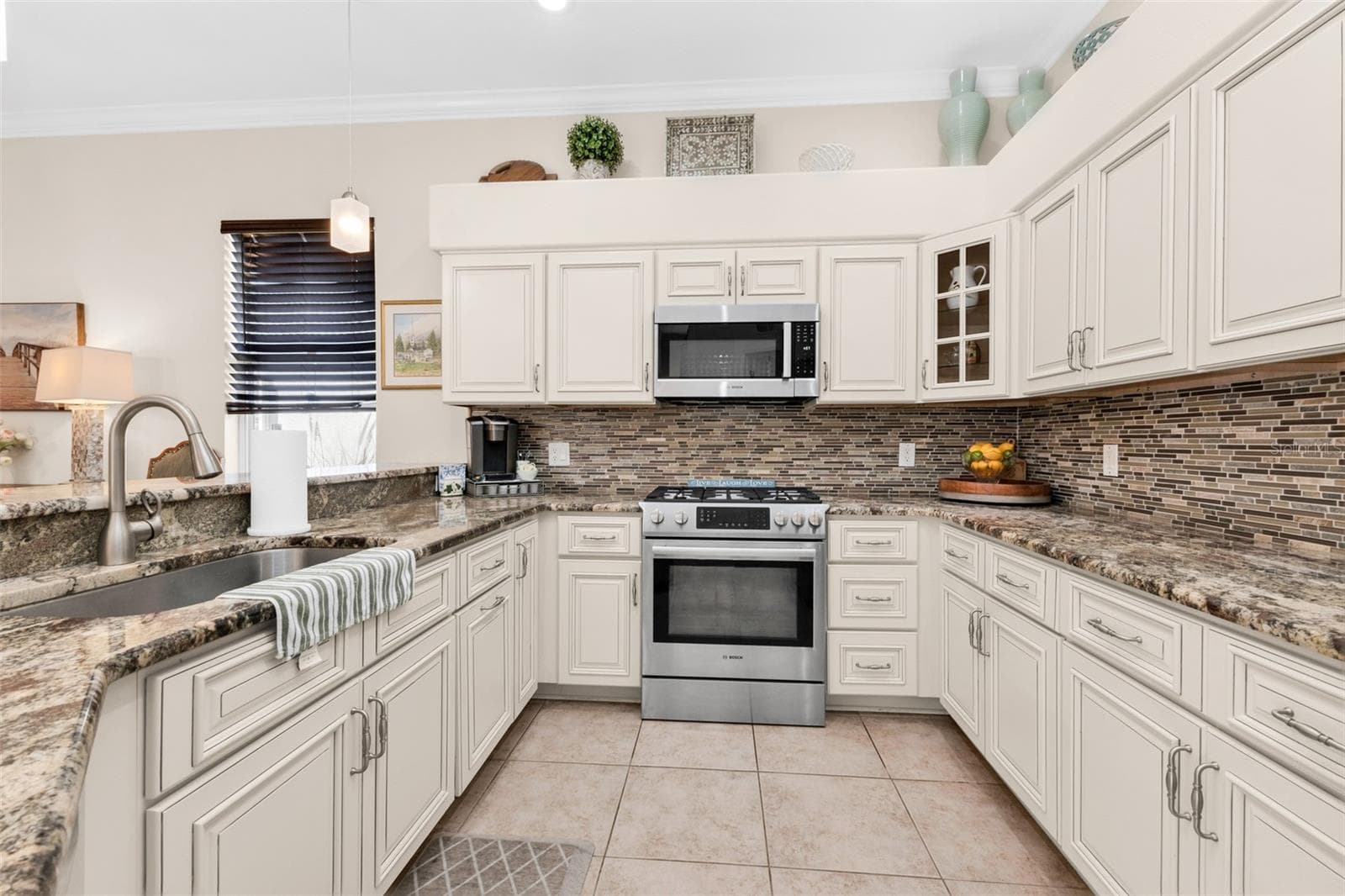 kitchen with gas stove - 2450 SILVER PALM RD, NORTH PORT