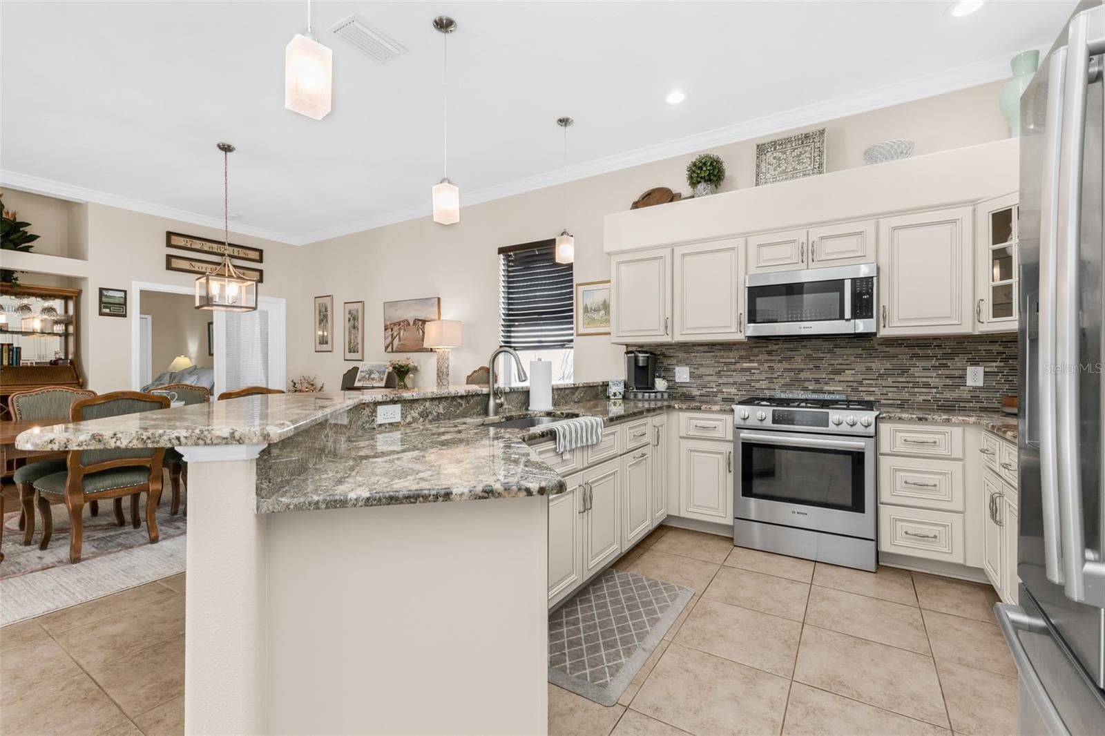 kitchen with gas stove - 2450 SILVER PALM RD, NORTH PORT