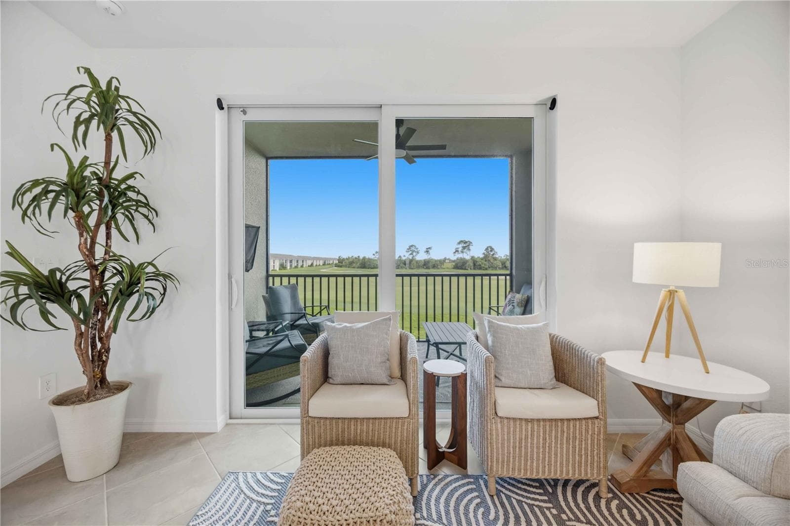 View of golf coursr from screened in balcony - 17565 OPAL SAND DR #205, VENICE