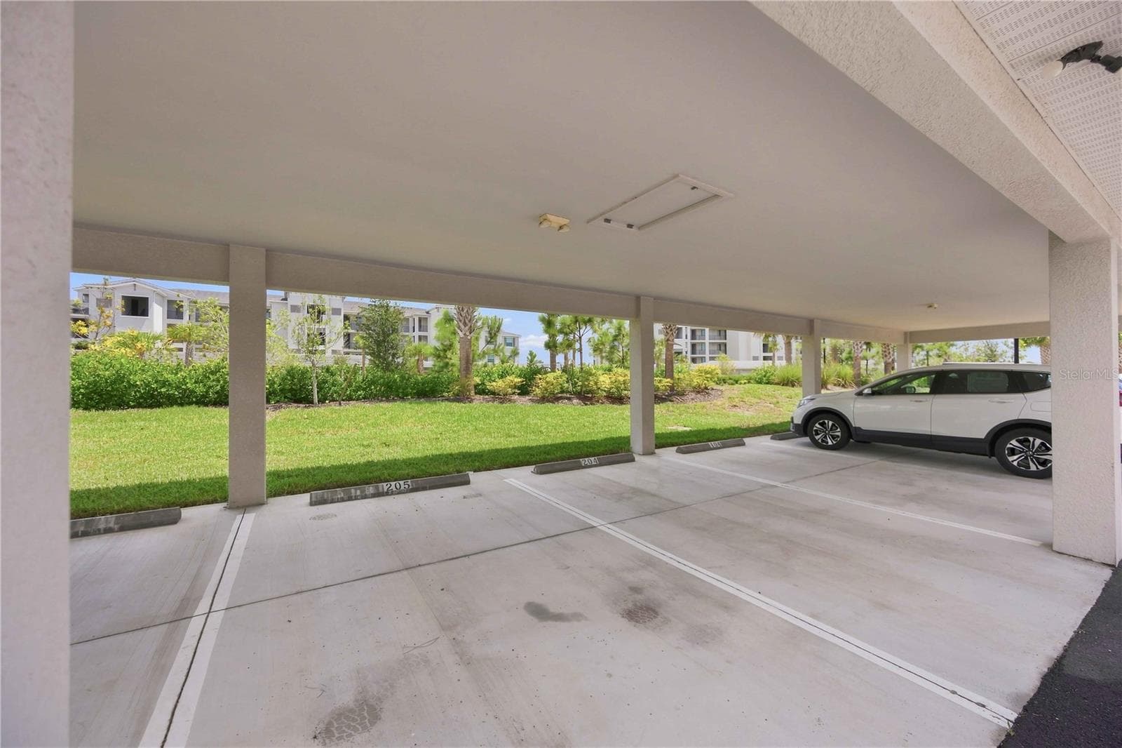 Covered assigned parking - 17565 OPAL SAND DR #205, VENICE