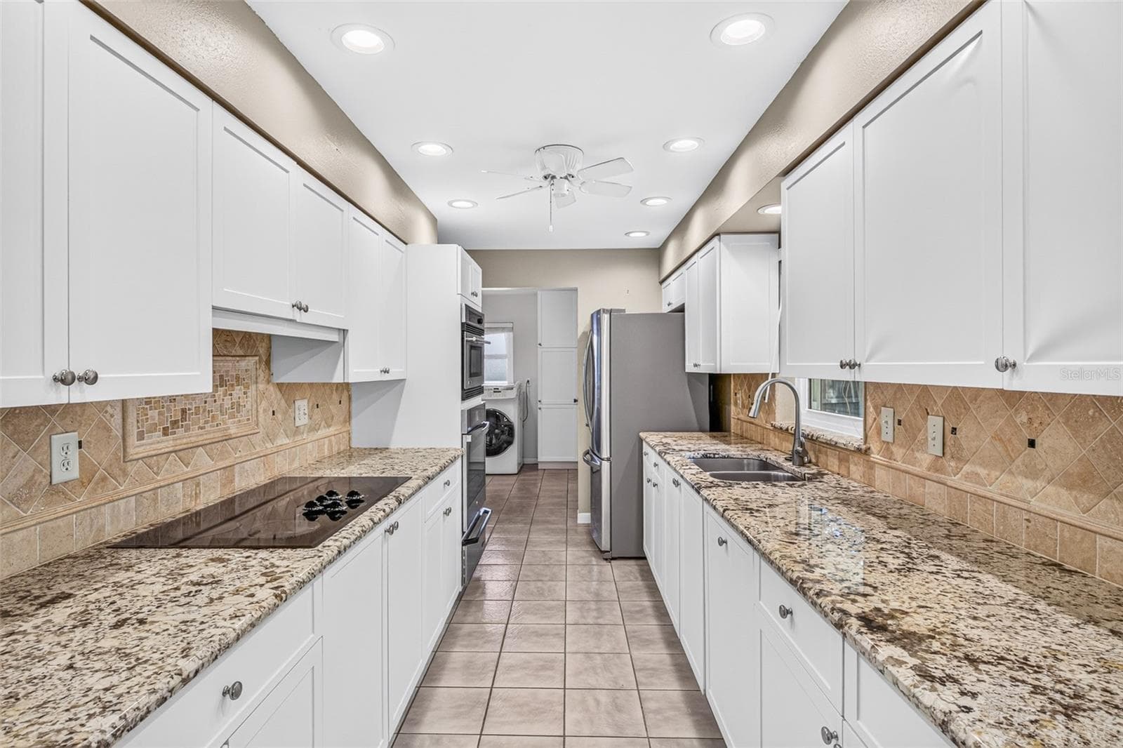 Kitchen to laundry - 301 VALENCIA CT, WINTER GARDEN