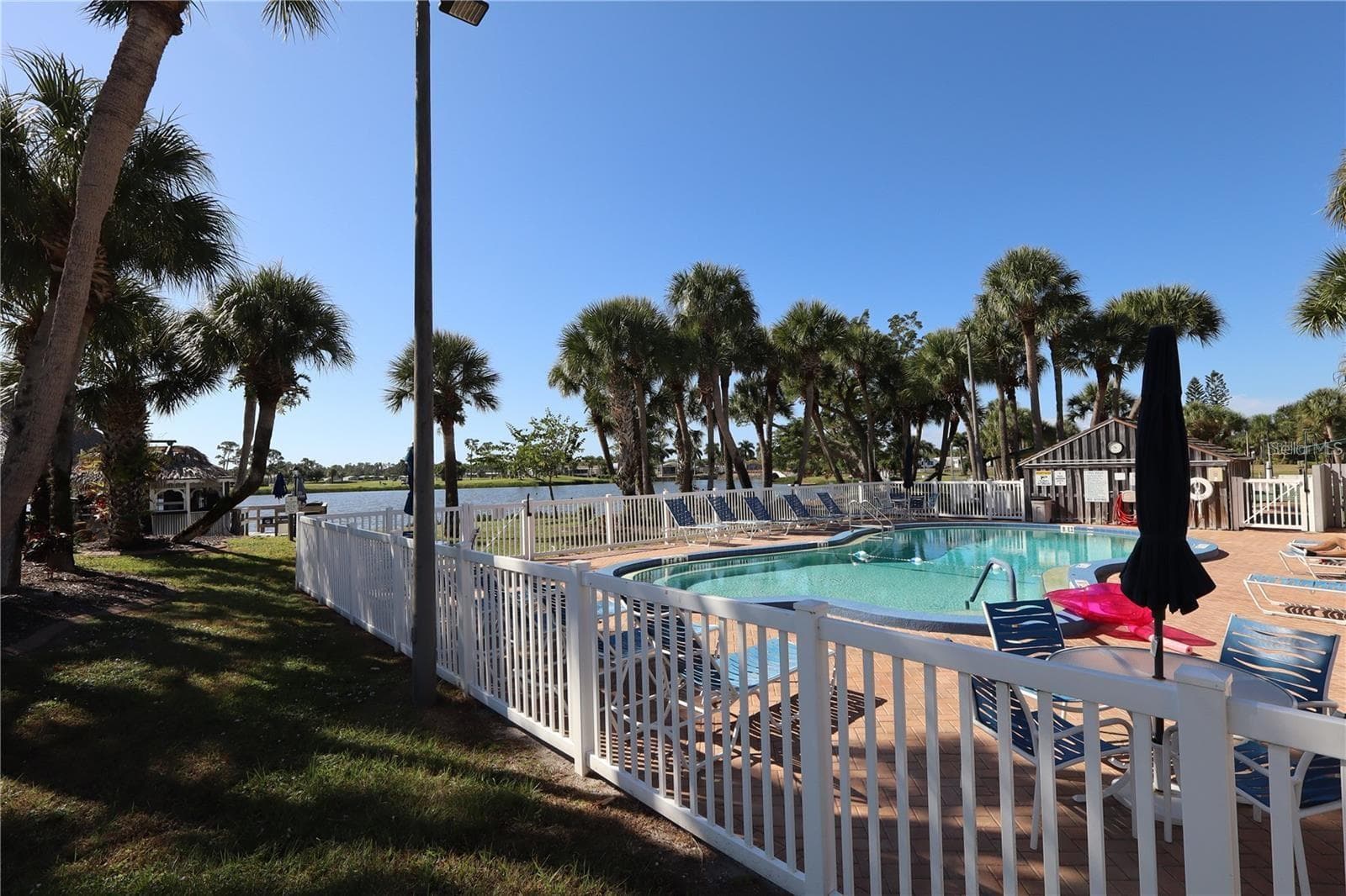 1 OF FOUR HEATED POOLS - 2100 KINGS HWY #144, PORT CHARLOTTE