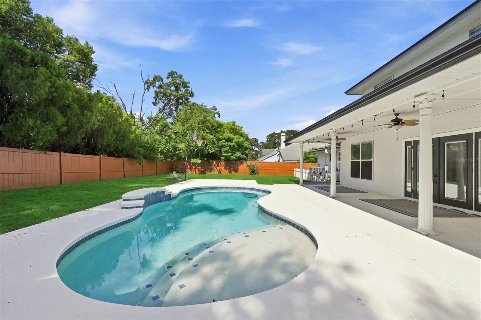 Private Saltwater Pool & Outdoor Living! Enjoy Florida living with a solar-heated saltwater pool, expansive pool deck, and covered outdoor entertaining area. - 1349 VALLEY PINE CIR, APOPKA