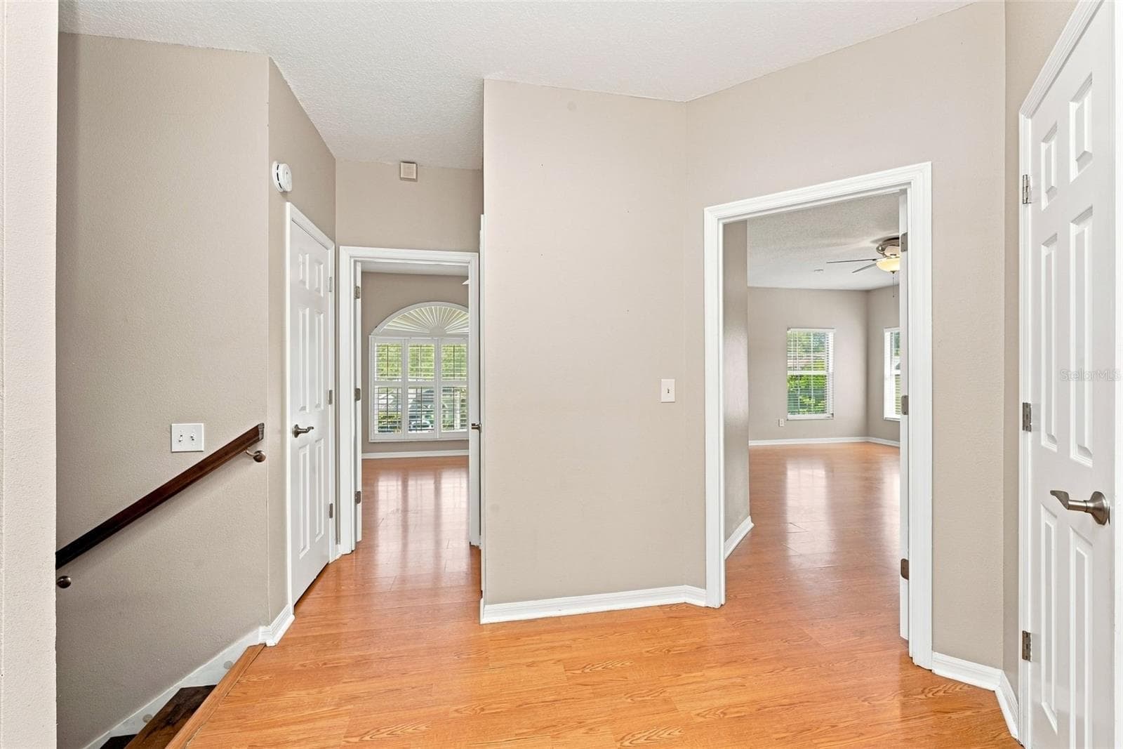 Second-Story Landing zone provides access to the upstairs bedrooms and creates additional flexibility for a reading area or workspace plus 3 additional storage closets! - 1349 VALLEY PINE CIR, APOPKA