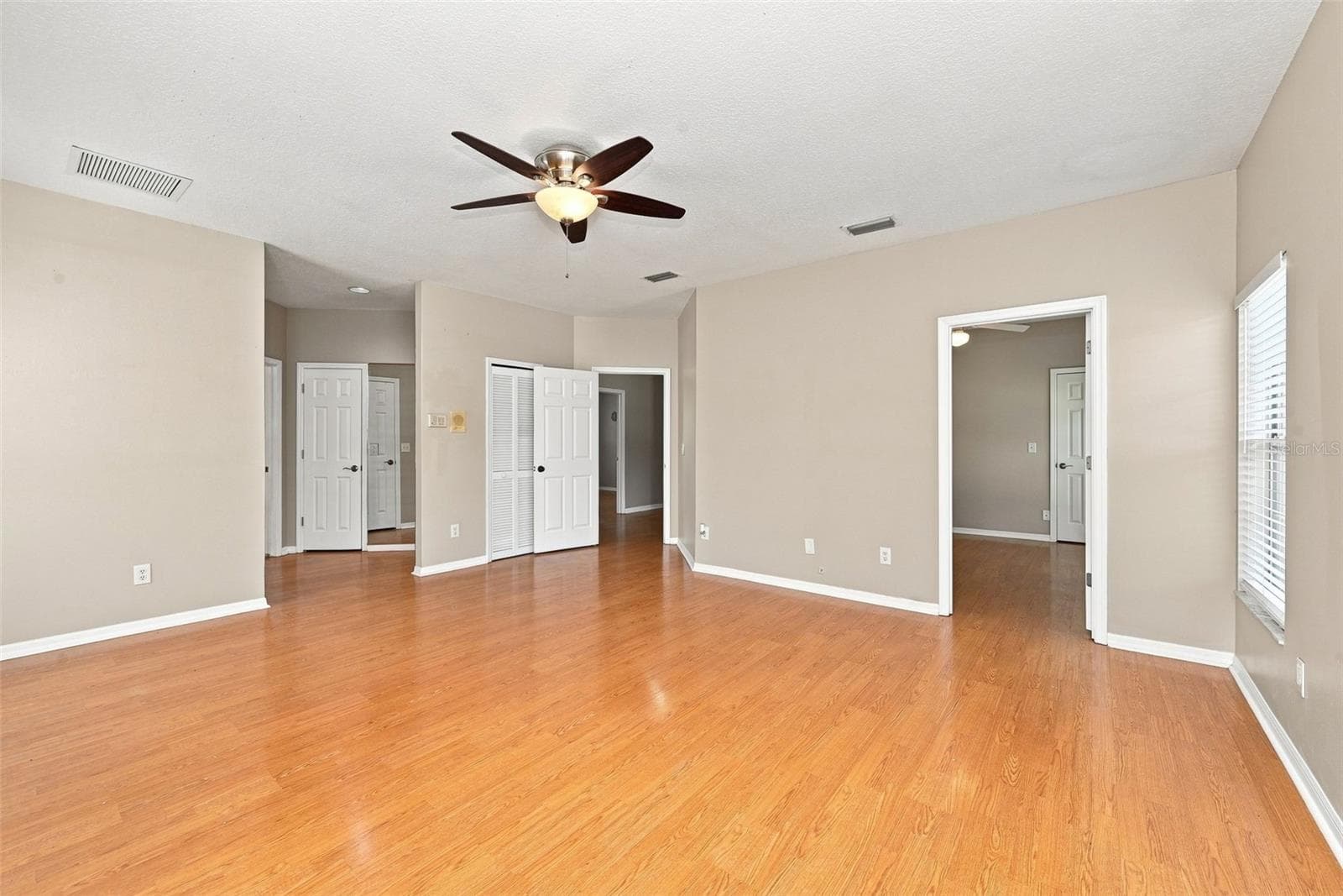 Versatile Primary Suite Layout includes generous bedroom space and an adjoining room that can function as a nursery, office, gym, sitting room, or private retreat. - 1349 VALLEY PINE CIR, APOPKA