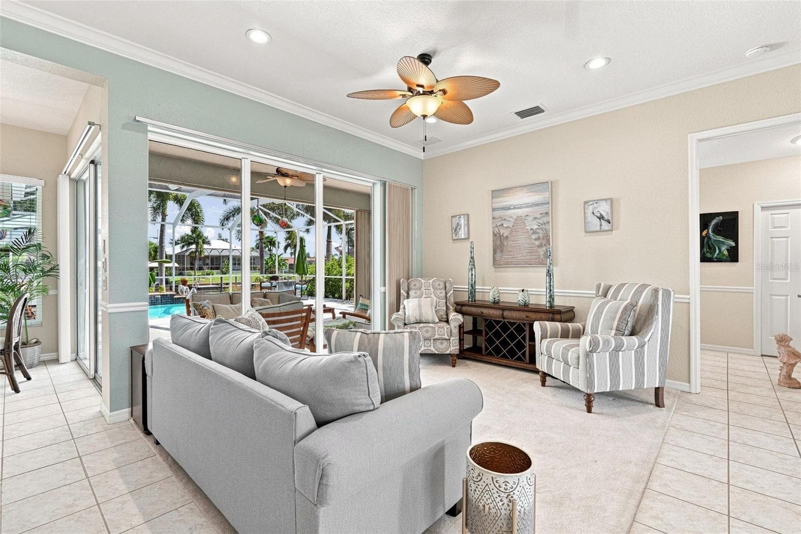 Living Room with Pool Views & Lanai Access - 136 PECKHAM ST SE, PORT CHARLOTTE
