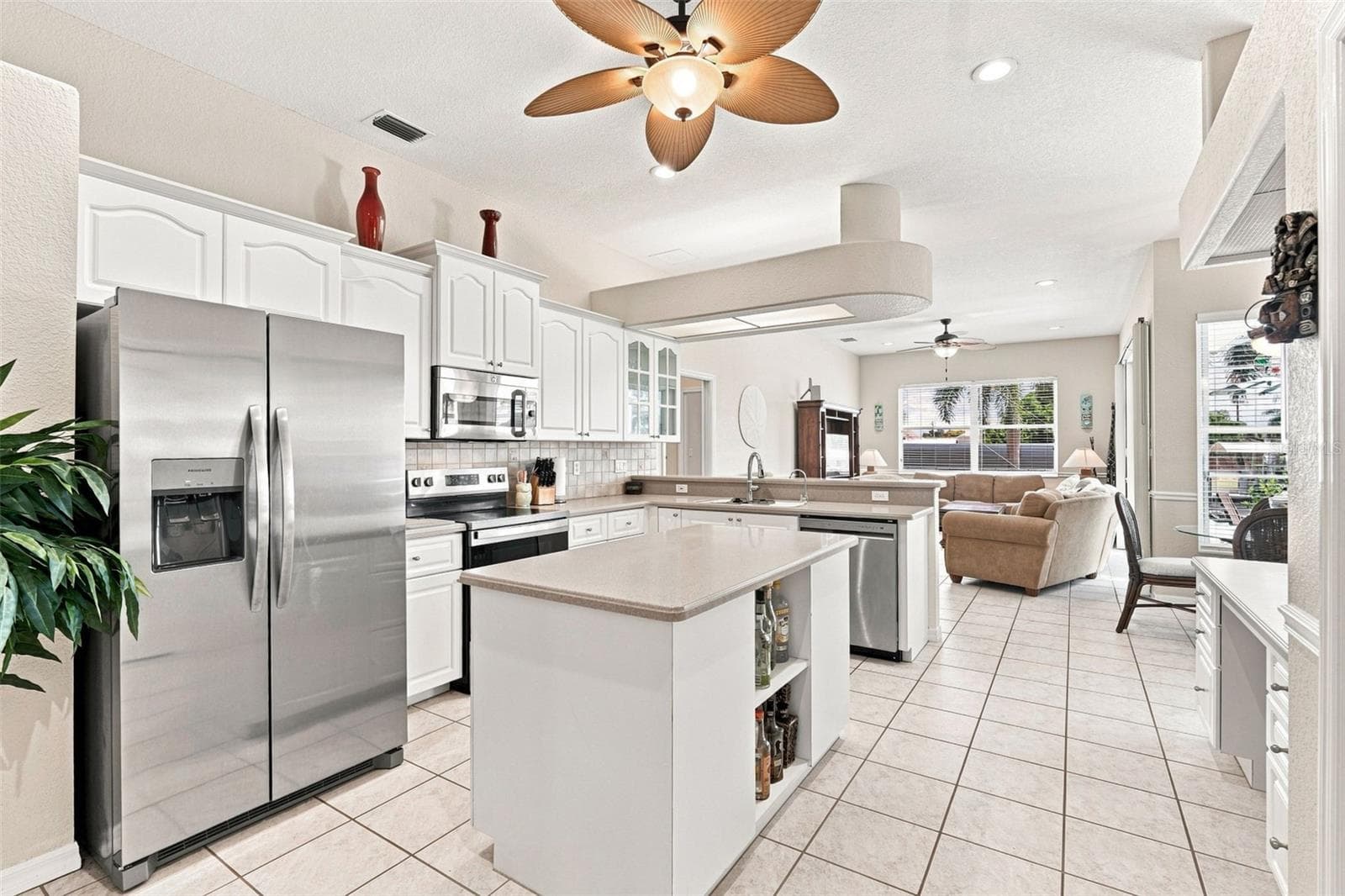 Open Kitchen with Center Island & Stainless Steel Appliances - 136 PECKHAM ST SE, PORT CHARLOTTE