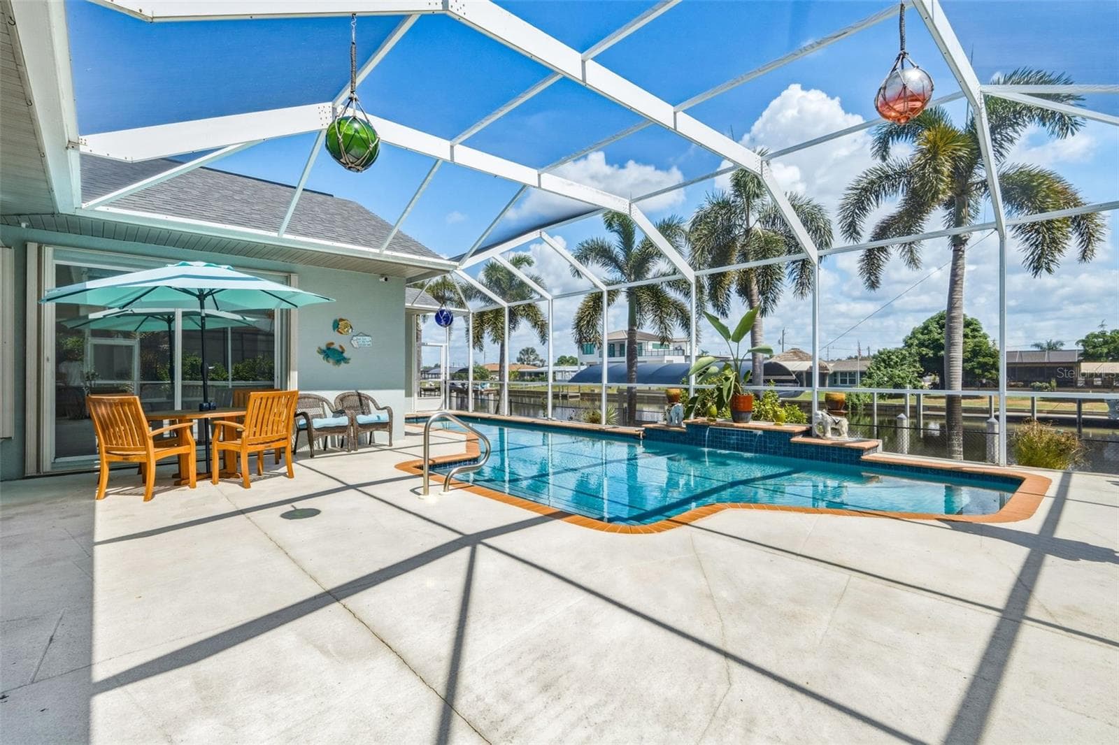 Screened Pool Oasis with Canal Views - 136 PECKHAM ST SE, PORT CHARLOTTE