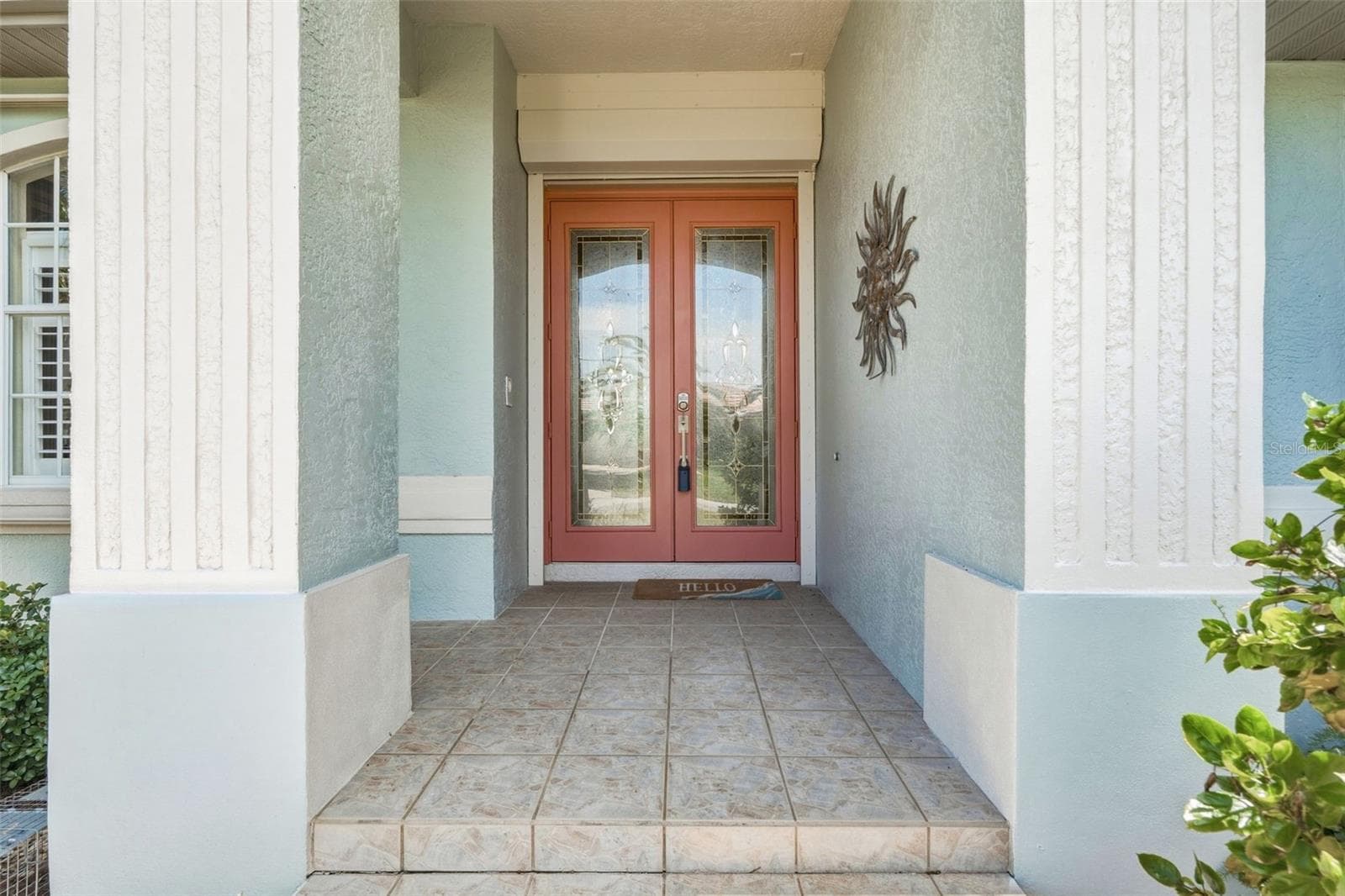 Welcoming Covered Front Entry with Leaded Glass Double Doors - 136 PECKHAM ST SE, PORT CHARLOTTE