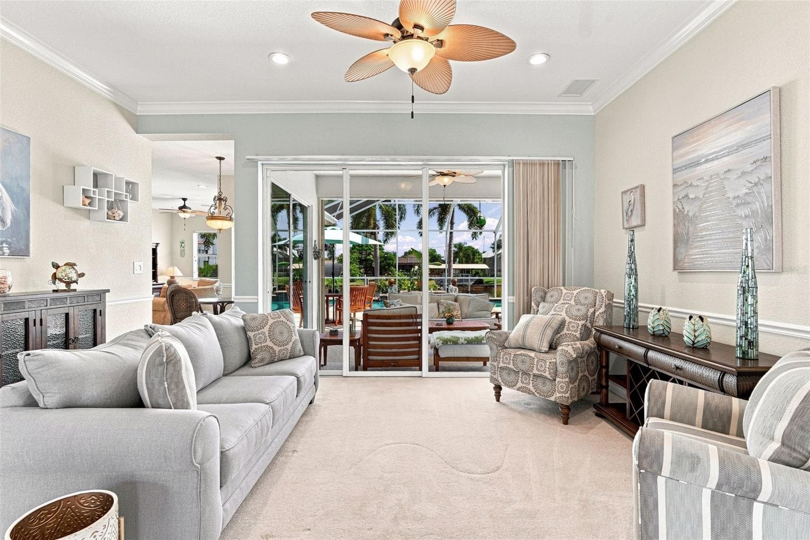 Living Room with Pool Views & Lanai Access - 136 PECKHAM ST SE, PORT CHARLOTTE