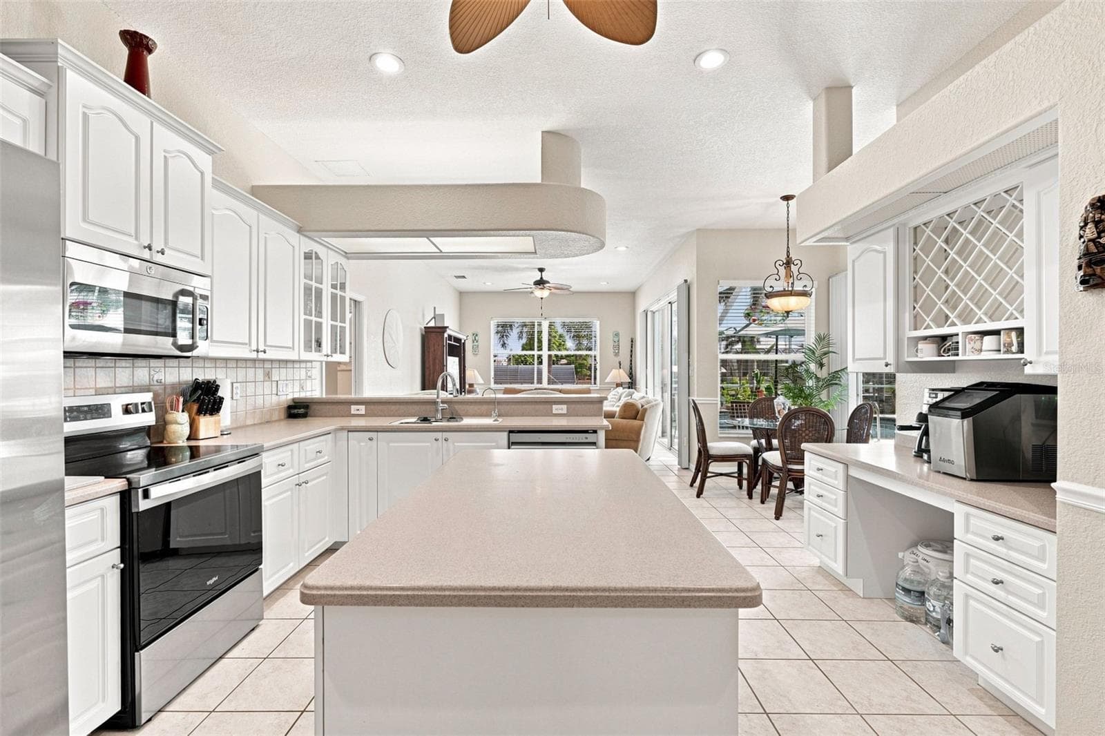 Rich Corian Countertops and Island Prep Area - 136 PECKHAM ST SE, PORT CHARLOTTE