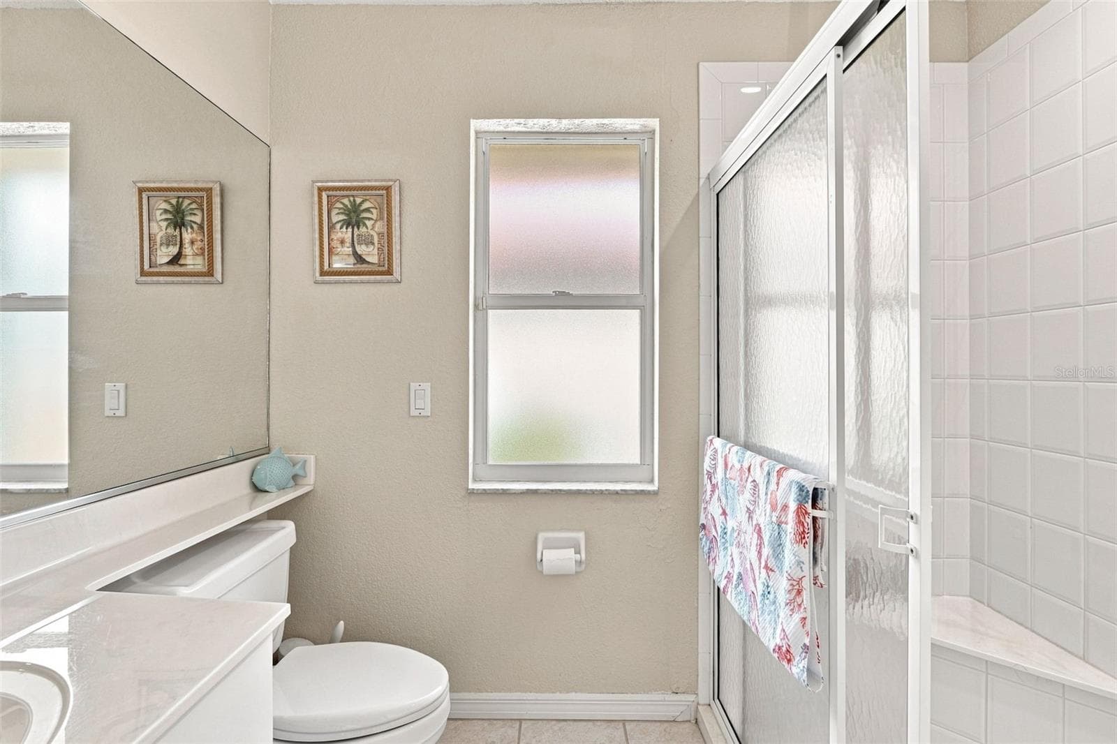 Guest Bathroom with Large Mirror, Vanity & Walk In Shower - 136 PECKHAM ST SE, PORT CHARLOTTE