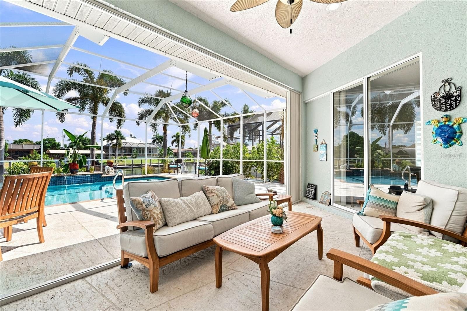 Covered Pool Area With Wide Water Views - 136 PECKHAM ST SE, PORT CHARLOTTE