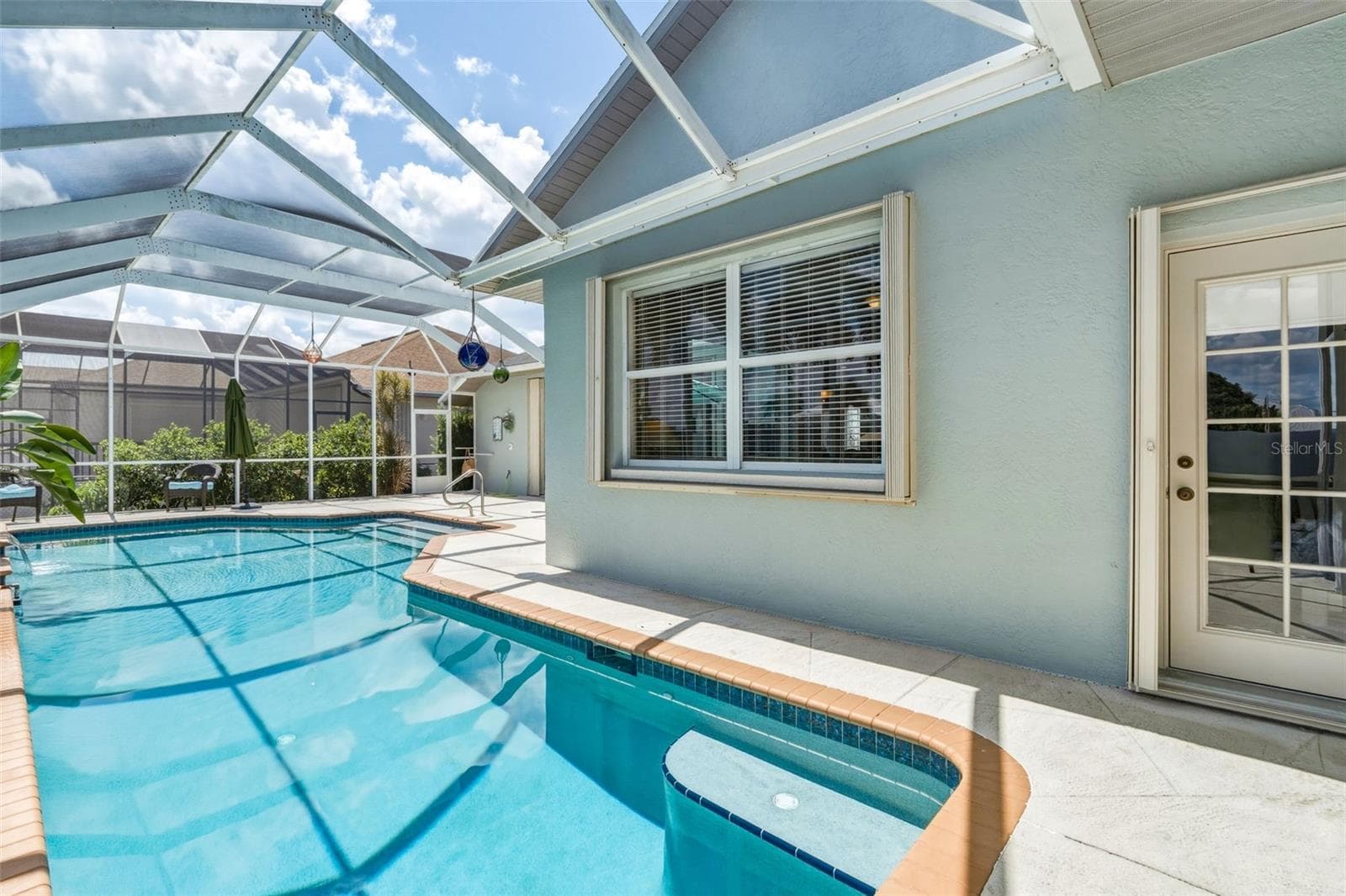 Exspansive Screened Pool Deck with Waterfront Views - 136 PECKHAM ST SE, PORT CHARLOTTE