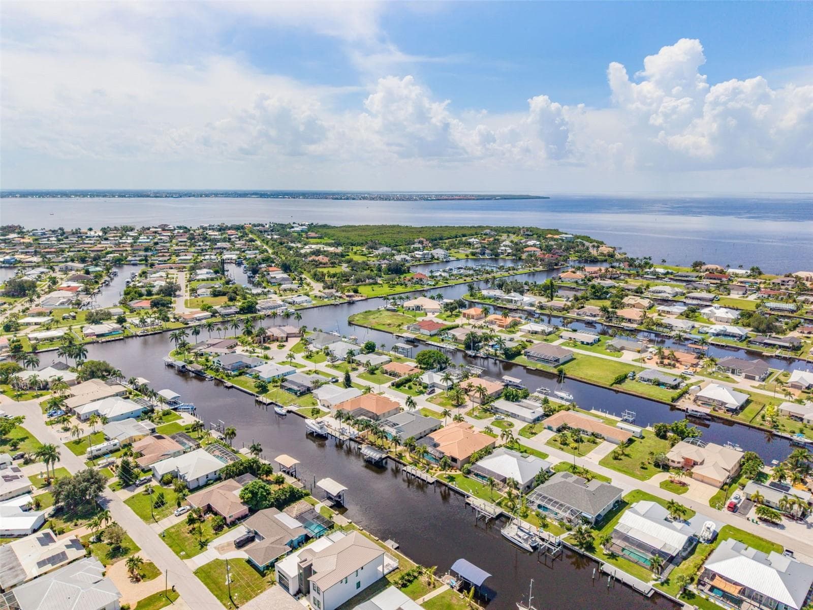 Aerial View of Home, Pool & Sailboat Canal - 136 PECKHAM ST SE, PORT CHARLOTTE