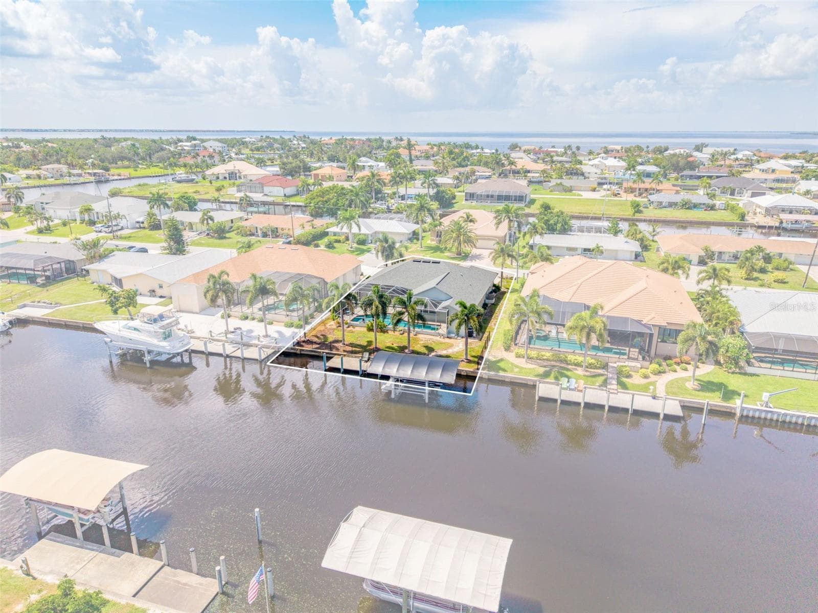 Aerial View of Home, Pool & Sailboat Canal - 136 PECKHAM ST SE, PORT CHARLOTTE