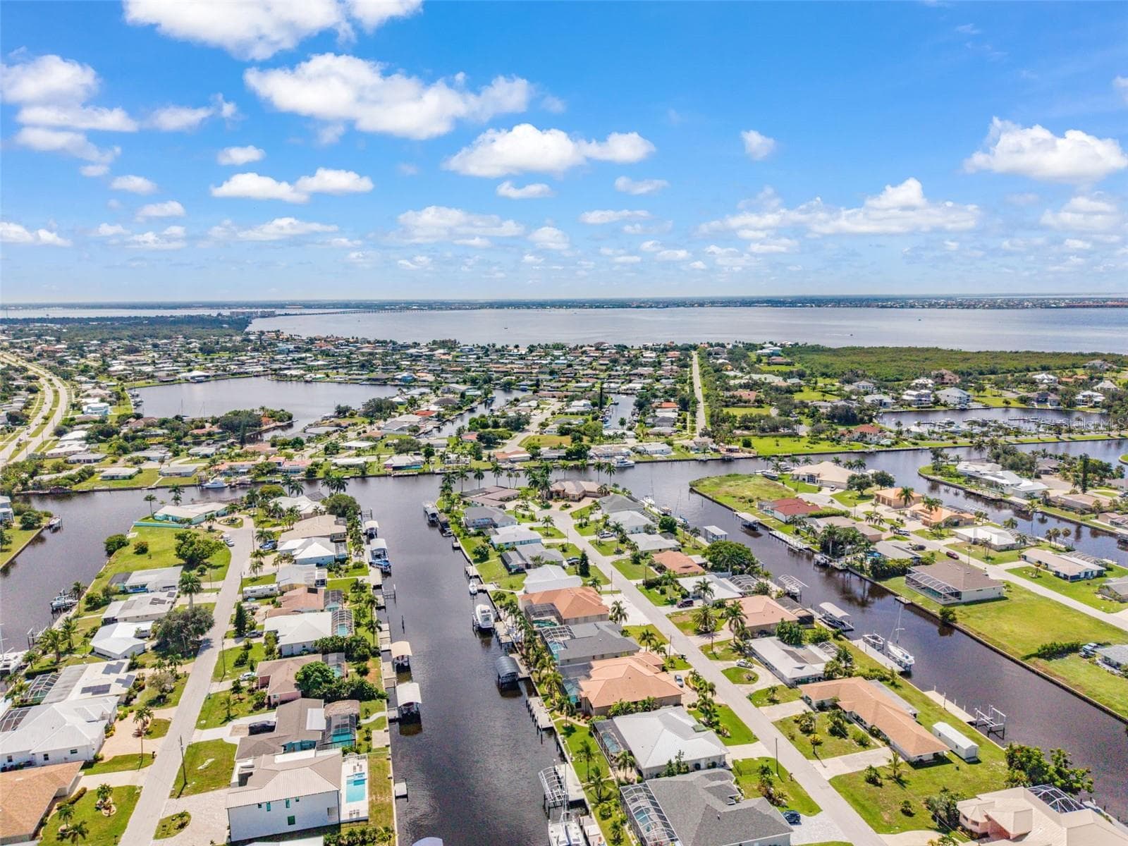Aerial View of Home, Pool & Sailboat Canal - 136 PECKHAM ST SE, PORT CHARLOTTE