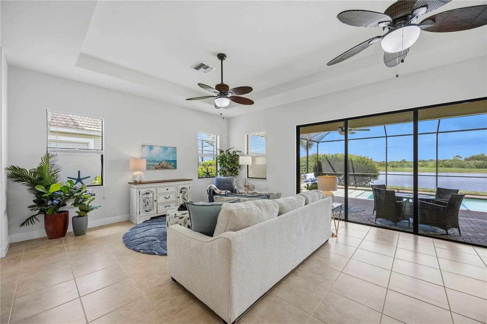 The living /great room in this home shares space with the dining area - - 23781 WAVERLY CIR, VENICE