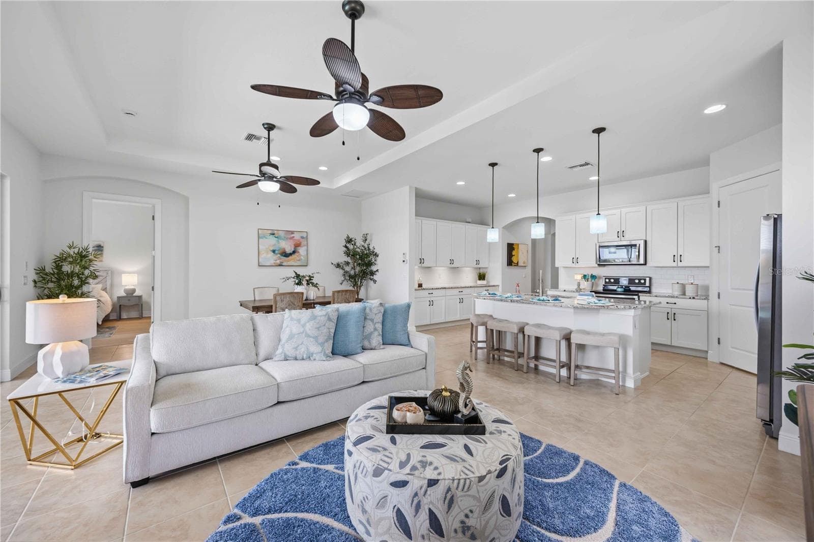 The living /great room in this home shares space with the dining area - - 23781 WAVERLY CIR, VENICE