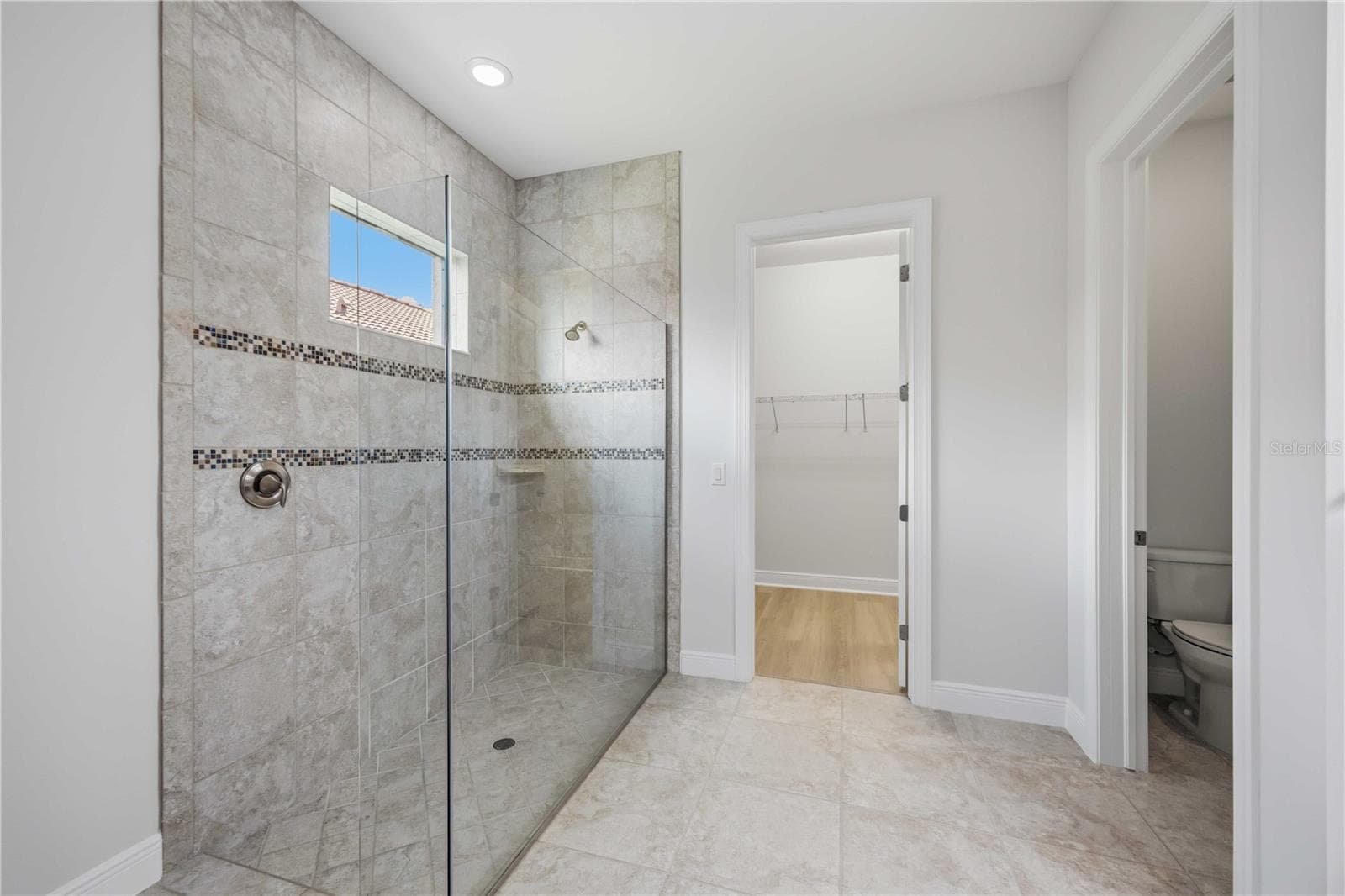 The ensuite bath in this home is fabulous - large walk in shower - 23781 WAVERLY CIR, VENICE