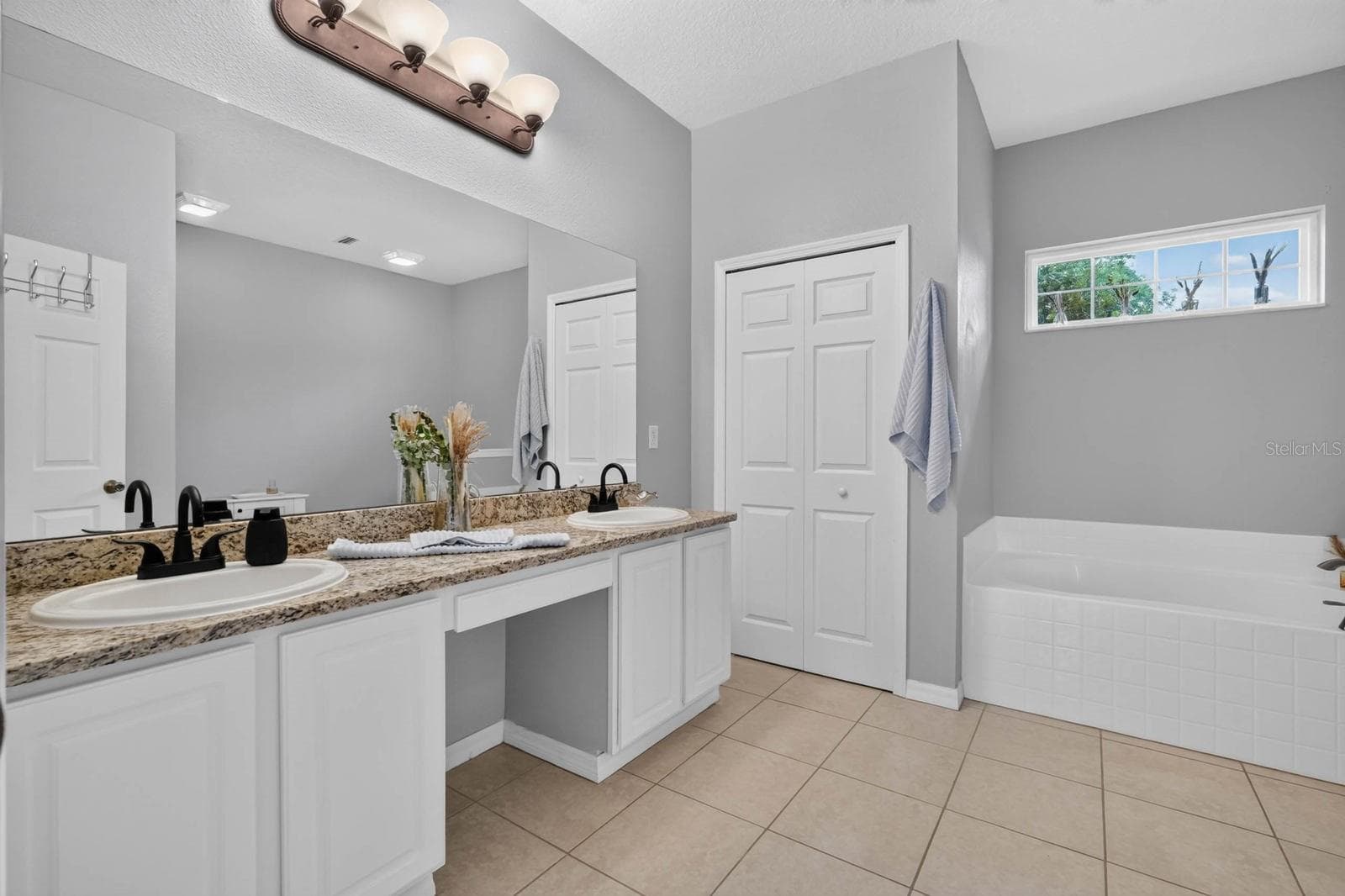Primary Bathroom - Dual Vanity Sinks - 100 FLAMINGO DR, PALM COAST