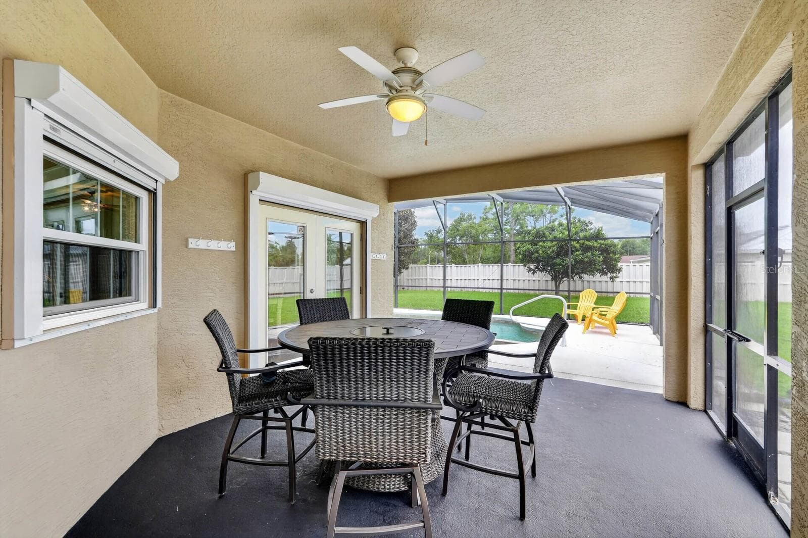 Covered patio area looking to pool area. - 100 FLAMINGO DR, PALM COAST