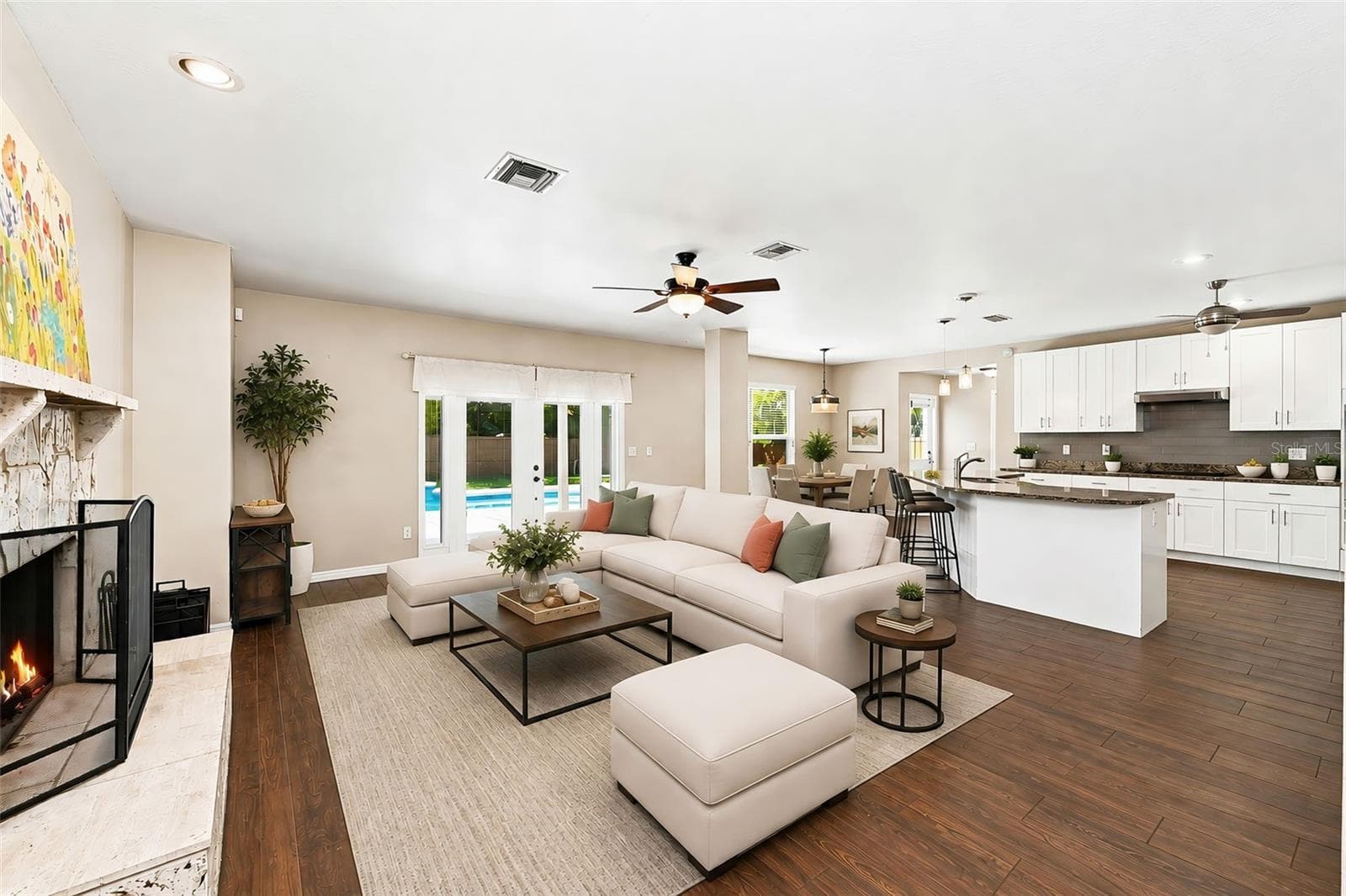 Open Floor Plan with Kitchen & Family Room offers easy entertaining and everyday living with direct views toward the private pool. - 1349 VALLEY PINE CIR, APOPKA