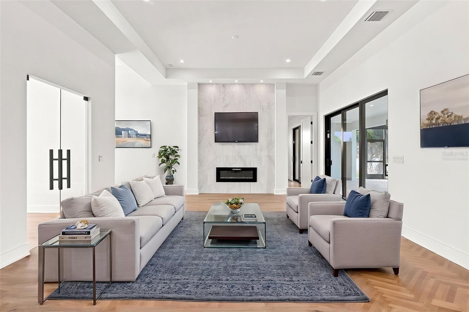 Virtually Staged Modern Living Room with Sleek Fireplace Wall & Waterfront Views - 44 SUNFLOWER DR, PLACIDA