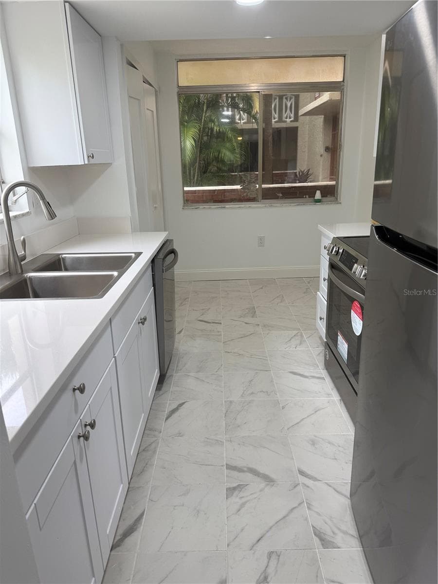 Kitchen with Previous/Old Windows - 1012 PEARCE DR #111, CLEARWATER