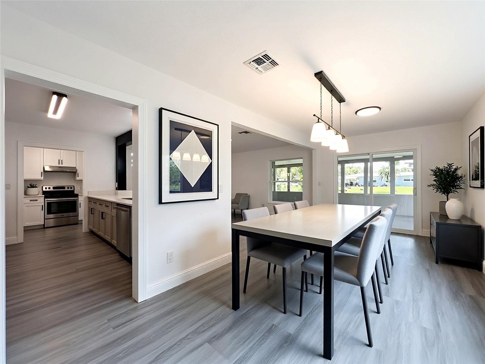 Imagine gathering here—an open layout connecting the living, dining and kitchen areas. - 3202 TRADEWINDS TRL, ORLANDO