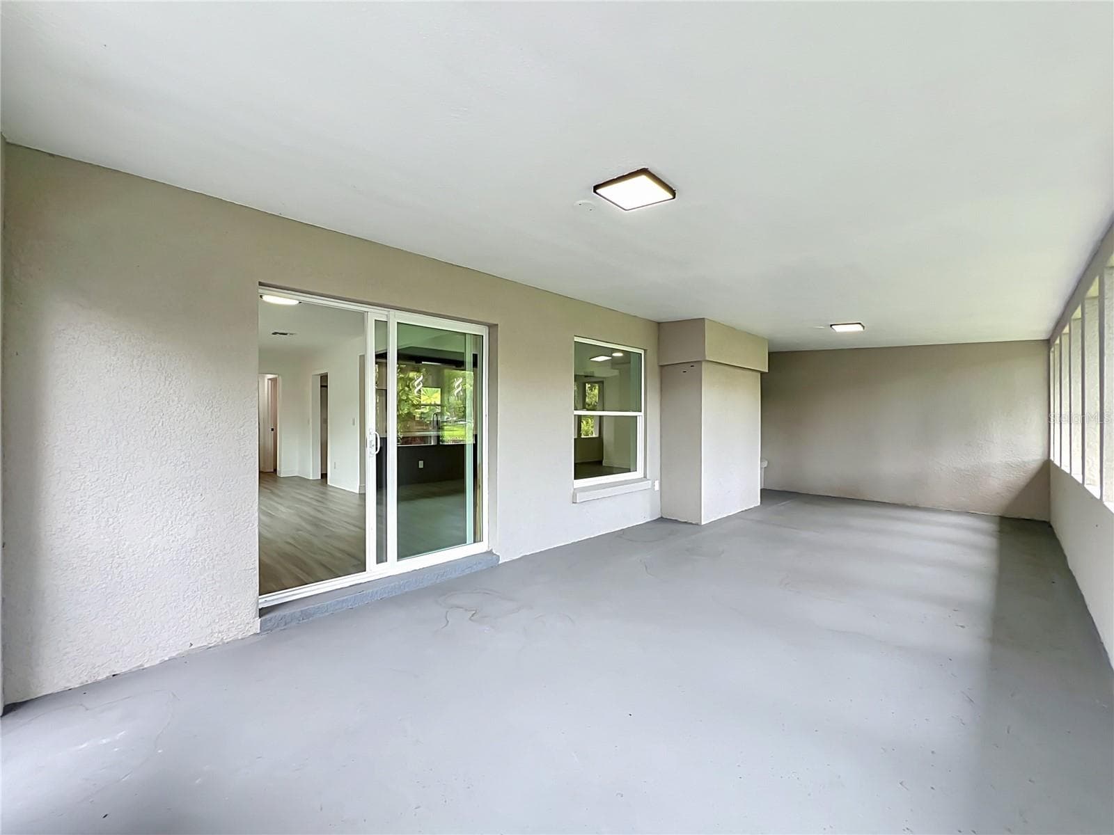 A huge covered patio extends your living space outdoors—perfect for Florida living. - 3202 TRADEWINDS TRL, ORLANDO