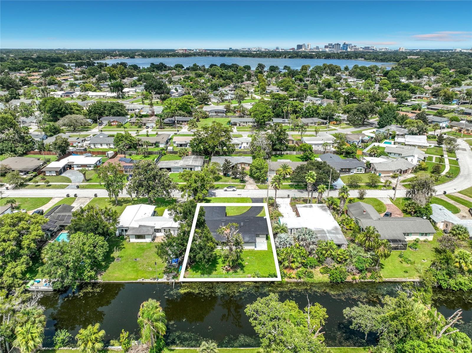 From above, see the home's setting within the surrounding neighborhood and waterways. - 3202 TRADEWINDS TRL, ORLANDO