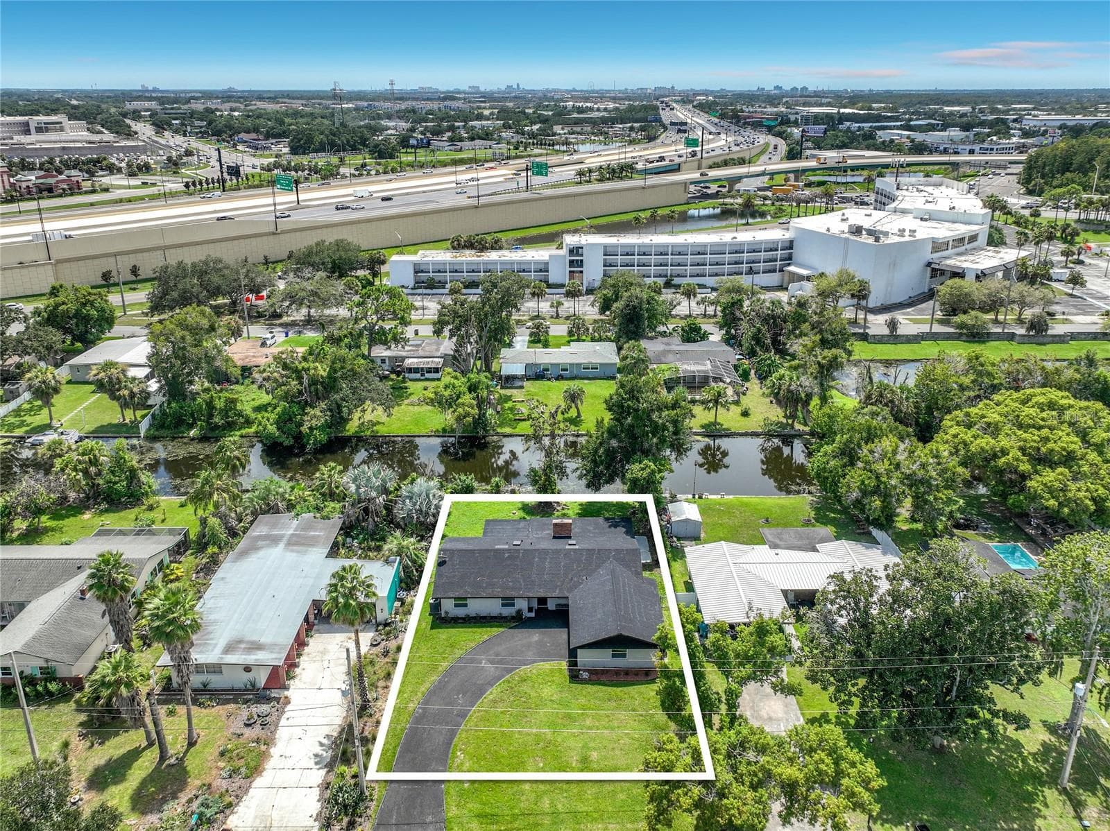 Aerial perspective highlighting the property, neighborhood and nearby connections. - 3202 TRADEWINDS TRL, ORLANDO