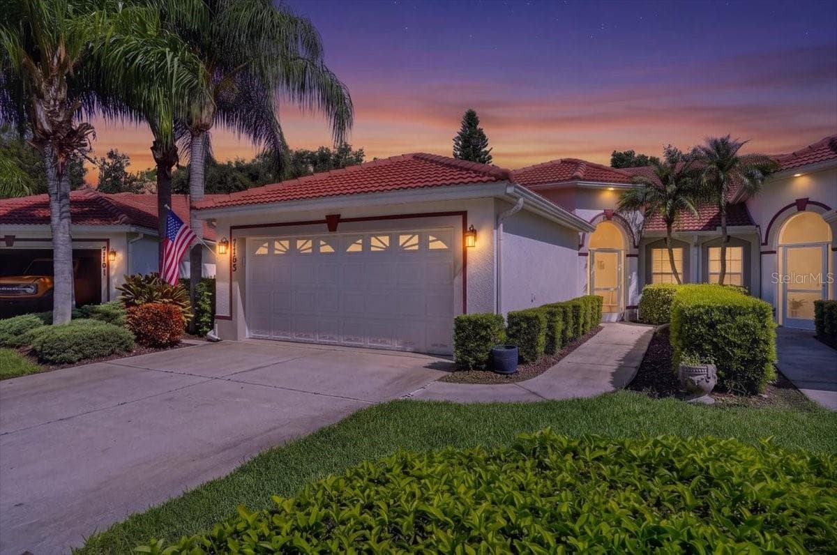 twilight front - 7165 MELROSE PL, BRADENTON